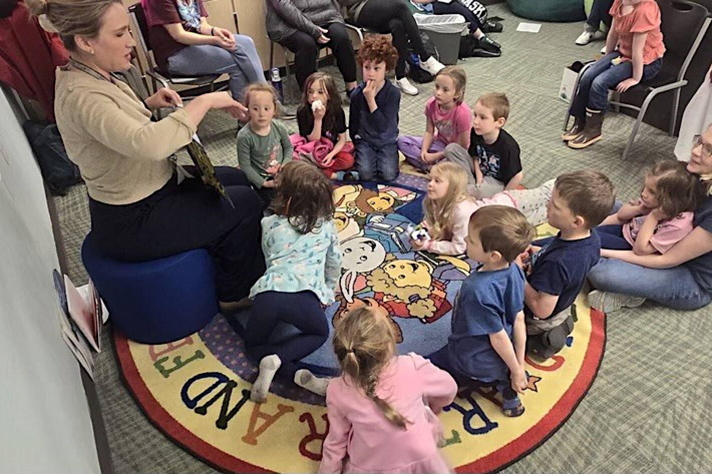 Students from Juneau Community Charter School listen to a story at the Skagway Public Library. (Photo provided by Clint Sullivan)