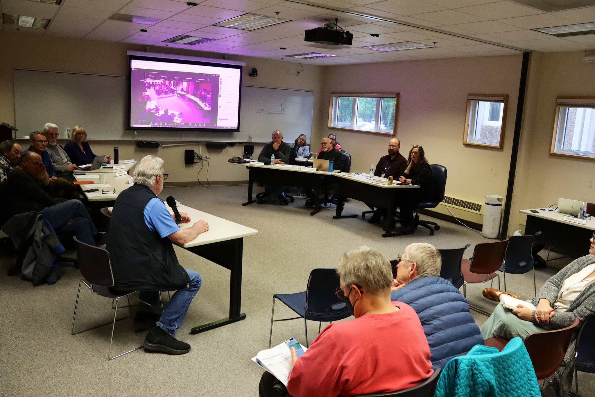 Leaders at Bartlett Regional Hospital listen to comments from residents during a forum Monday about proposed cuts to some services. (Mark Sabbatini / Juneau Empire)