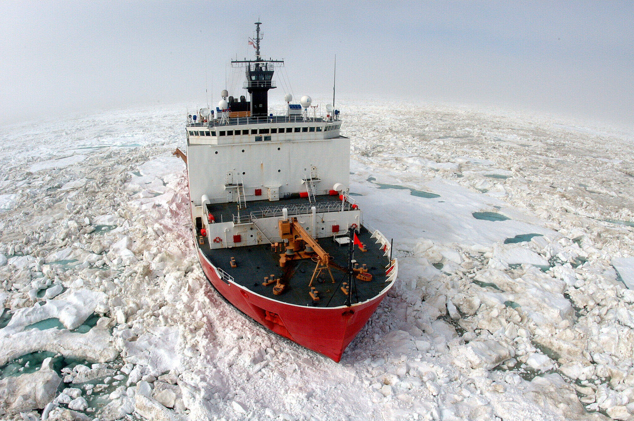 The U.S. Coast Guard Cutter Healy, a 420-foot icebreaker homeported in Seattle, breaks ice in support of scientific research in the Arctic Ocean during a 2006 cruise. The Healy is now on its way to Alaska and scheduled to complete three missions this year, including a sailing through the Northwest Passage to Greenland. (Petty Officer Second Class Prentice Danner/U.S. Coast Guard)