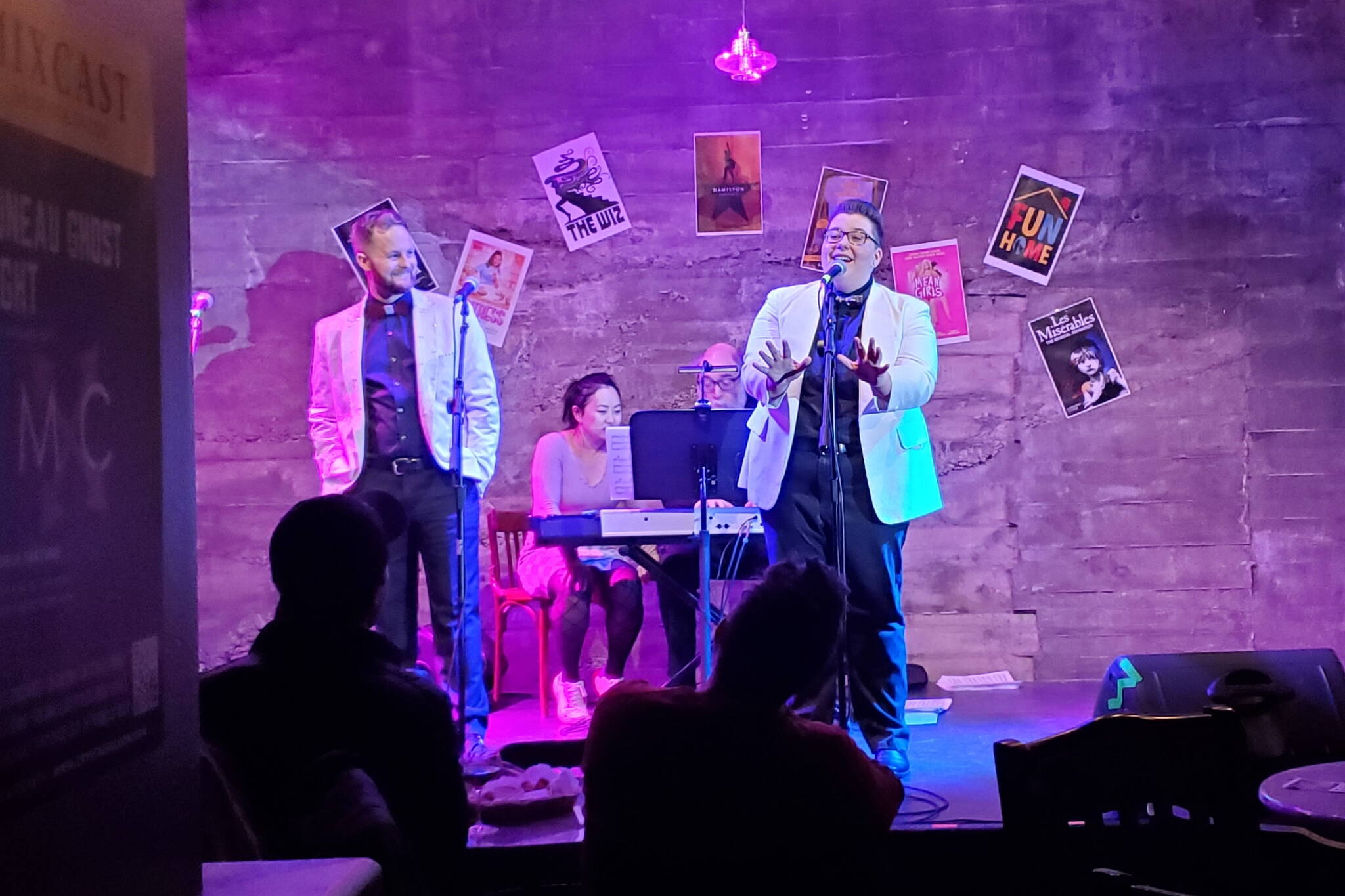Joshua Midgett and Kelsey Bryce Riker appear on stage as the emcees for MixCast 2023 at the Crystal Saloon. (Photo courtesy Juneau Ghost Light Theatre)