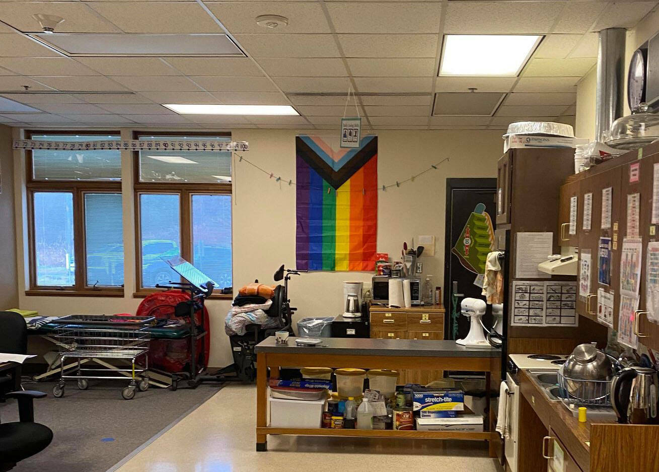 A Pride flag hangs in a Kenai Peninsula Borough School District room. (Peninsula Clarion file photo)