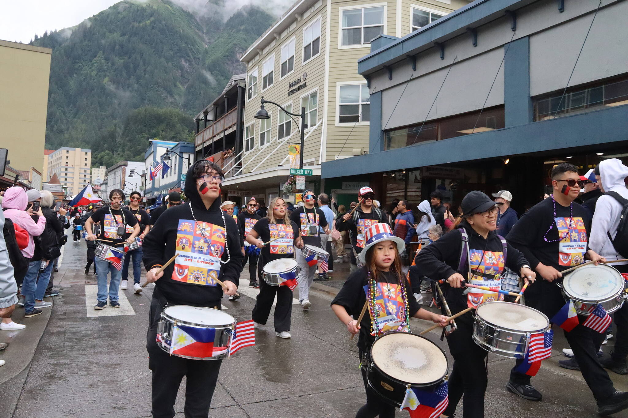Drummers with the Ati-Atihan Juneau Group make their way along Franklin Street during Juneau’s annual Fourth of July parade on Thursday morning. (Mark Sabbatini / Juneau Empire)