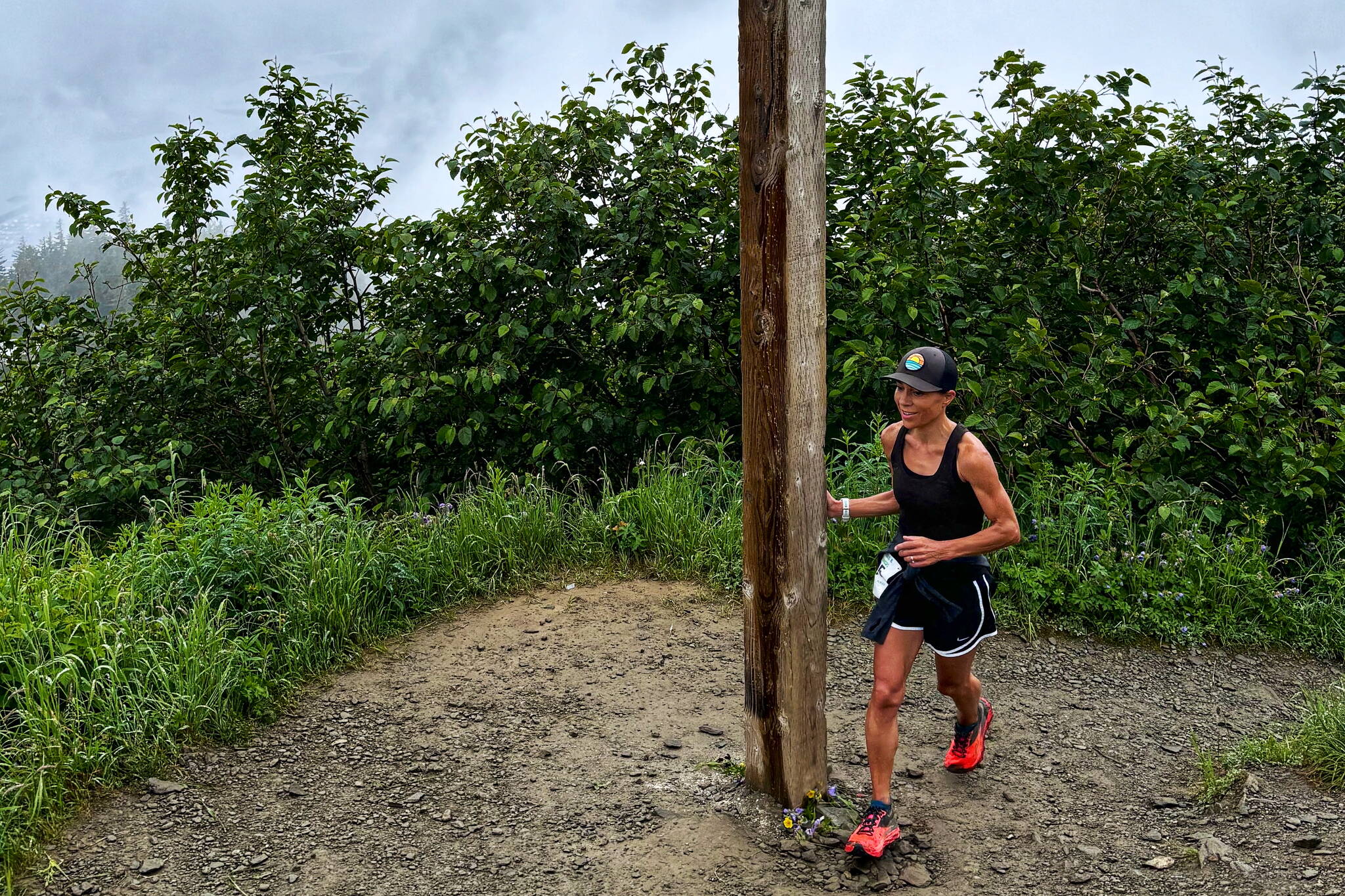 Heidi Reifenstein reaches Father Brown’s Cross to complete the Goldbelt Tram-Mount Roberts Trail Run on Saturday, setting a new women’s record for the 3½-mile race with a time of 37 minutes and 40 seconds. (Photo by Jeff Gnass)