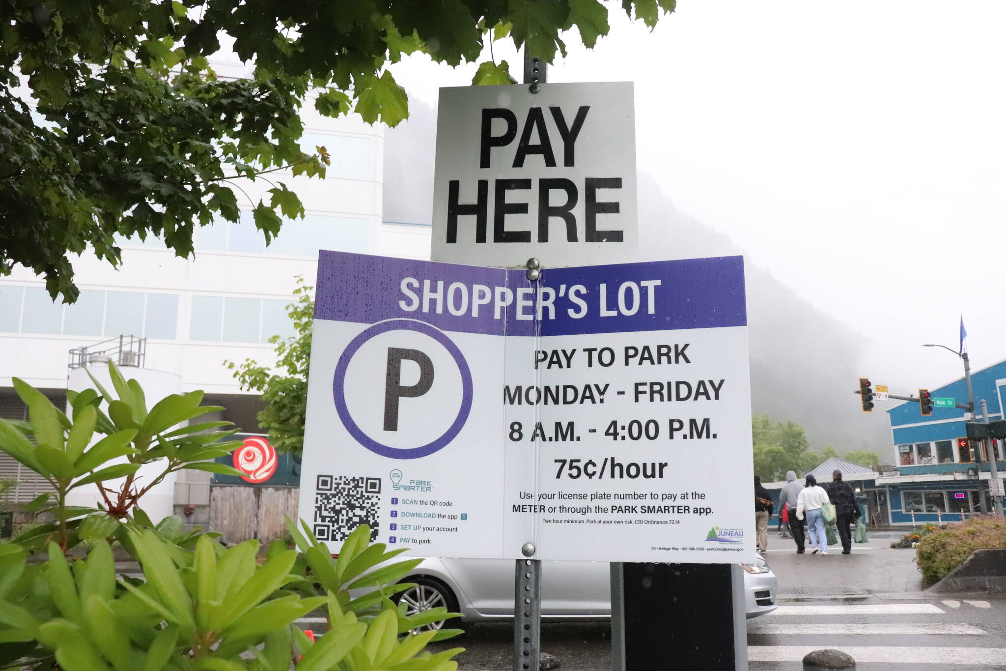 A pay to park sign is seen by the Downtown Transit Center on July 2, 2024. (Jasz Garrett / Juneau Empire)