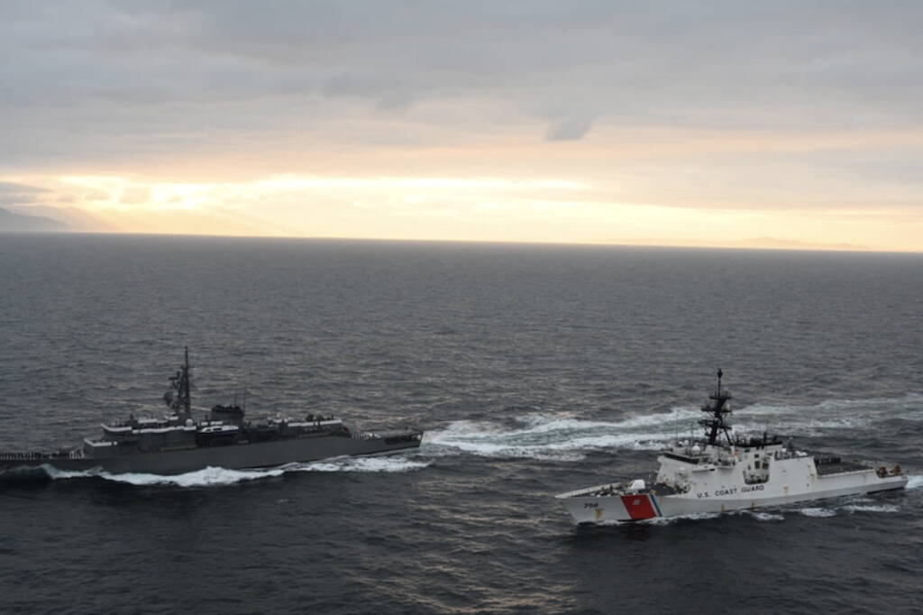 The U.S. Coast Guard Cutter Kimball, right, and a Japanese naval training vessel travel near the island of Unalaska in 2021. The Kimball intercepted a group of Chinese military vessels operating near the Aleutian Islands on July 6 and 7. (U.S. Coast Guard photo)