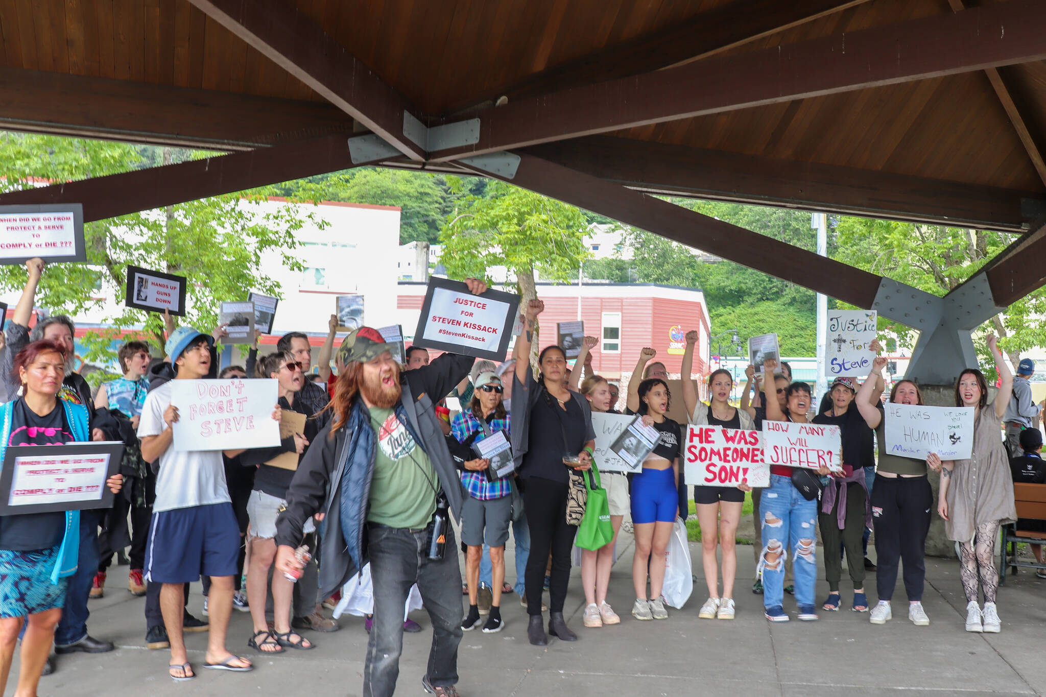 People protesting the death of Steven Kissack gather at Marine Park after marching through downtown Juneau on Sunday afternoon. (Jasz Garrett / Juneau Empire)