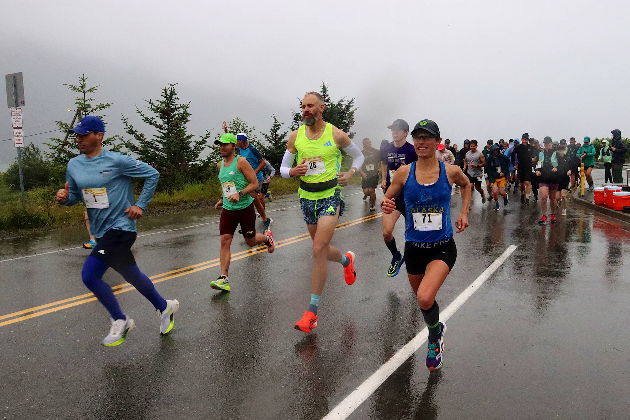 Runners begin the 26.2-mile Juneau Marathon at Savikko Park on Saturday morning. More than 85 people registered for the full-length race, a record for the annual event that originated in 1992, but about 20 of them failed to show up for what turned out to be a rainy run. (Mark Sabbatini / Juneau Empire)
