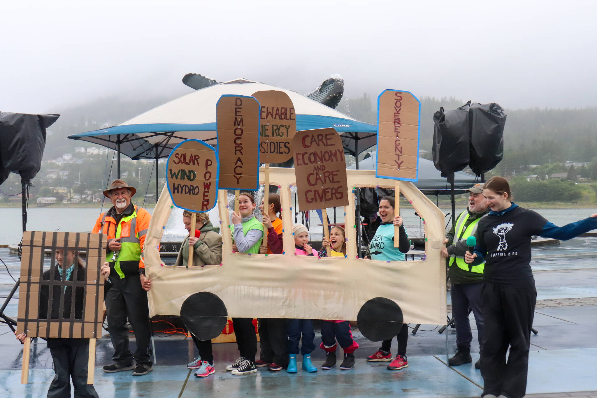 “Dreaming the Future” written by Mike Tobin and directed by Donnie Gott, and performed as part of the Climate Fair for a Cool Planet at Bill Overstreet Park on Saturday, ends with actors in an electric bus driving toward the future. (Jasz Garrett / Juneau Empire)