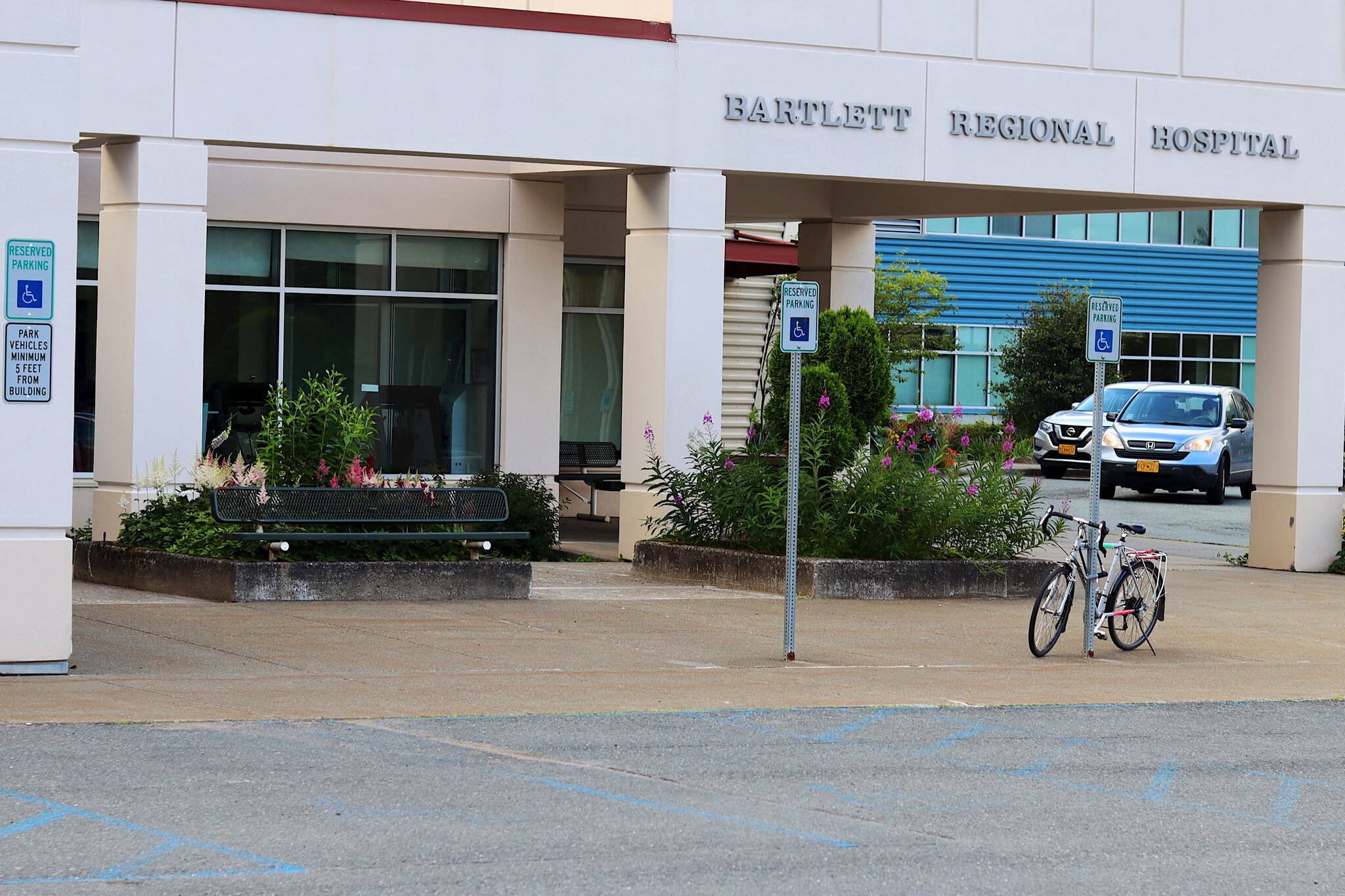 A bike is parked outside the main entrance of Bartlett Regional Hospital on Thursday, July 27, 2023. (Mark Sabbatini / Juneau Empire file photo)