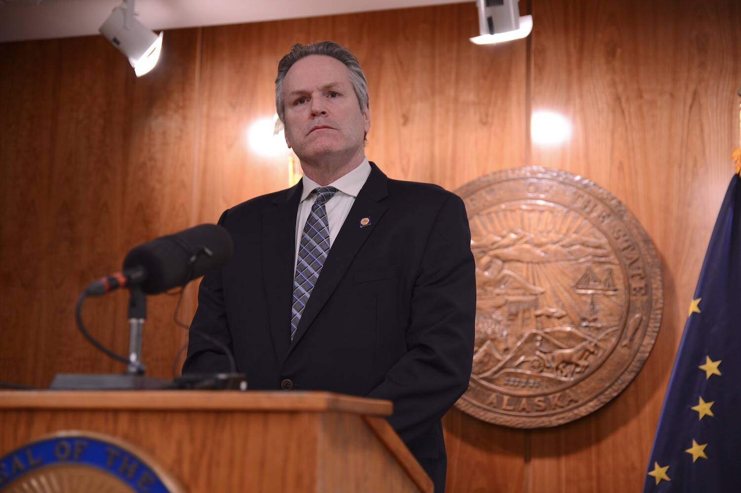 Gov. Mike Dunleavy speaks to reporters during a news conference Wednesday, Feb. 7, 2024. (James Brooks/Alaska Beacon)