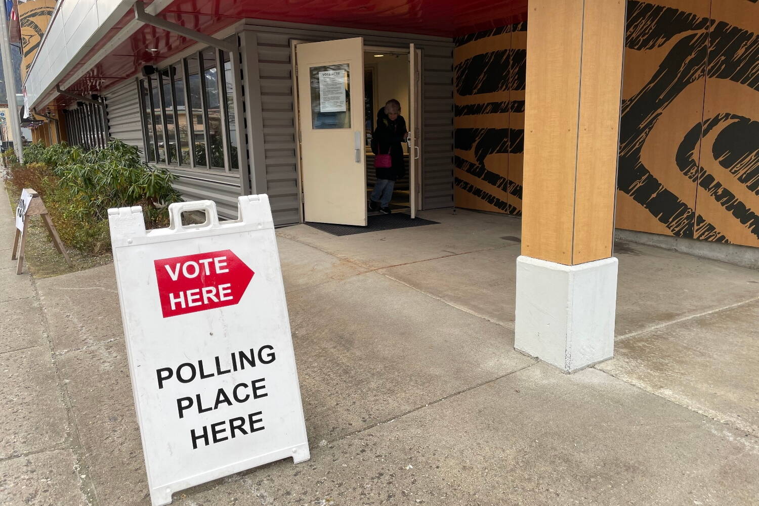 Voters in Juneau come out of the Elizabeth Peratrovich Hall voting location on Nov. 8, 2022. (Lisa Phu/Alaska Beacon)