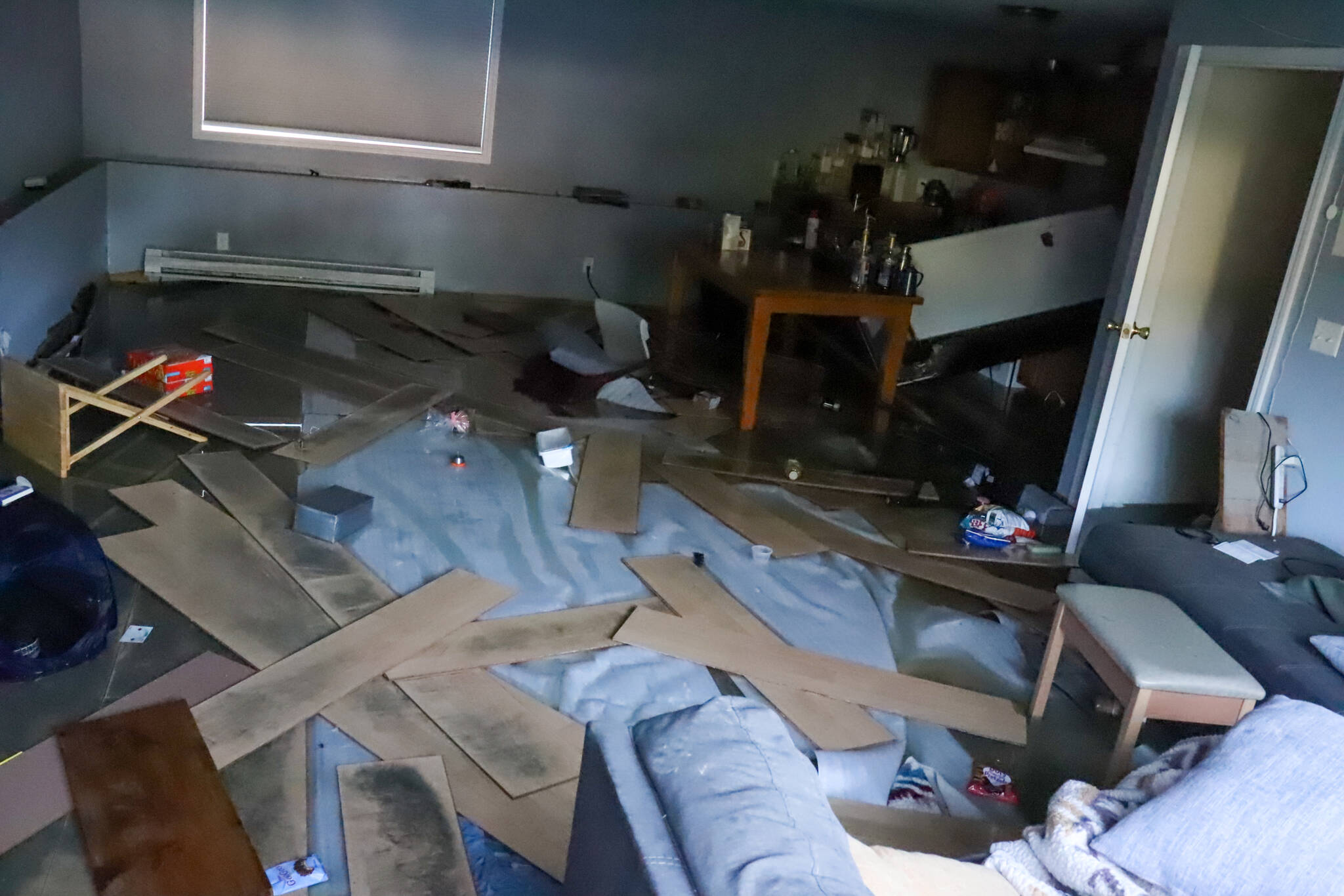 The aftermath of the flood is seen in Maggie Nolen’s basement apartment on Tuesday afternoon. (Jasz Garrett / Juneau Empire)