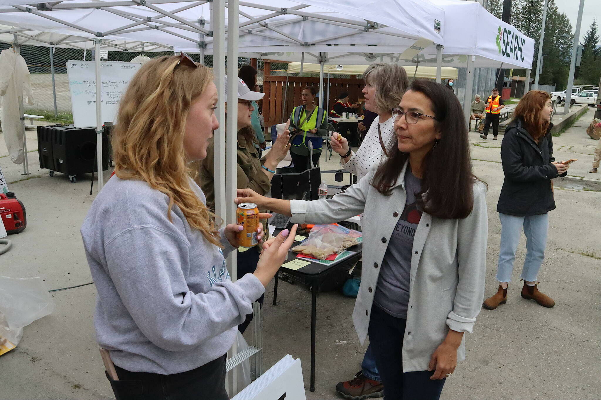 Brenna Heintz explains work being done at the Melvin Park flood recovery center to U.S. Rep. Mary Peltola on Sunday. Two disaster assistance centers are scheduled to open at other locations in Juneau from Wednesday through Friday of this week. (Mark Sabbatini / Juneau Empire file photo)