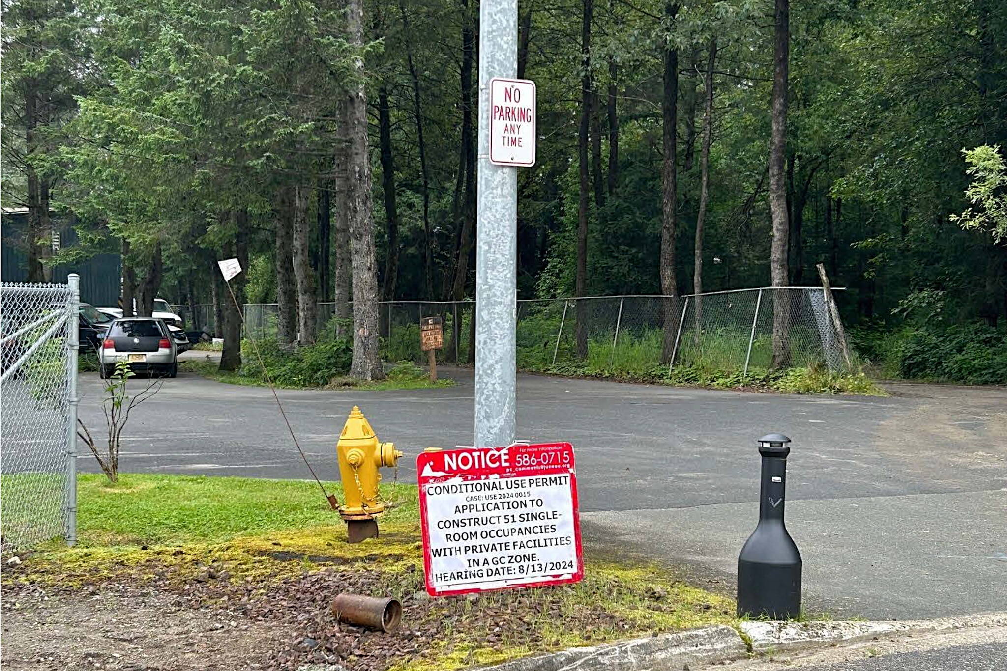 A sign notifies people about plans by Gastineau Human Services to build a 51-unit apartment building in a Lemon Creek neighborhood. (Photo from Juneau Planning Commission documents)