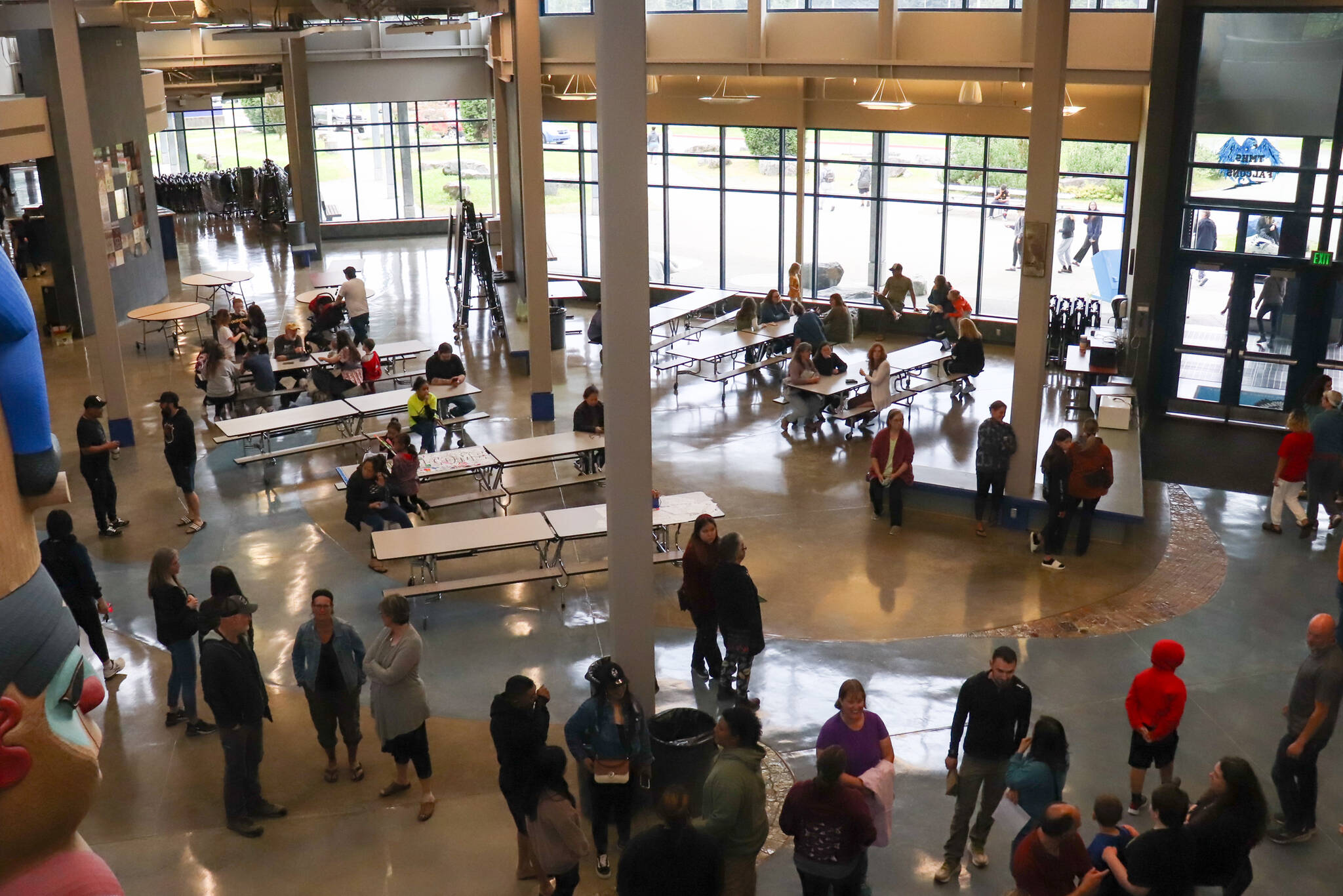 Families, students and teachers mingle during a Thunder Mountain Middle School open house on Tuesday evening. (Jasz Garrett / Juneau Empire)