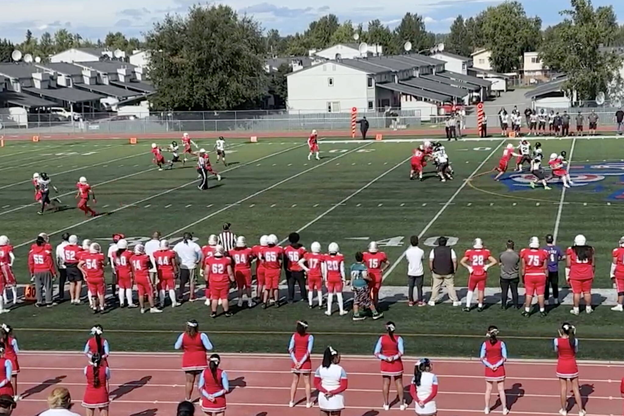 The Juneau High School Huskies try to convert a 4th-and-long situation on the road against Bettye Davis East Anchorage High School on Saturday. (Screenshot from Juneau Huskies Football livestream)