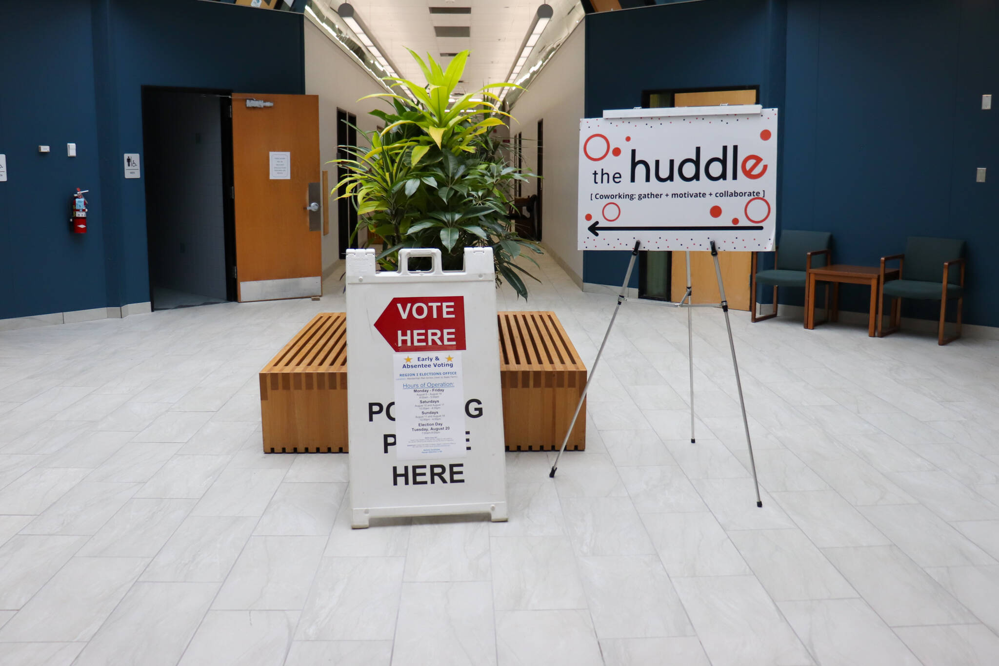 A sign inside the Mendenhall Mall Annex points toward a polling place on Tuesday morning. (Jasz Garrett / Juneau Empire)