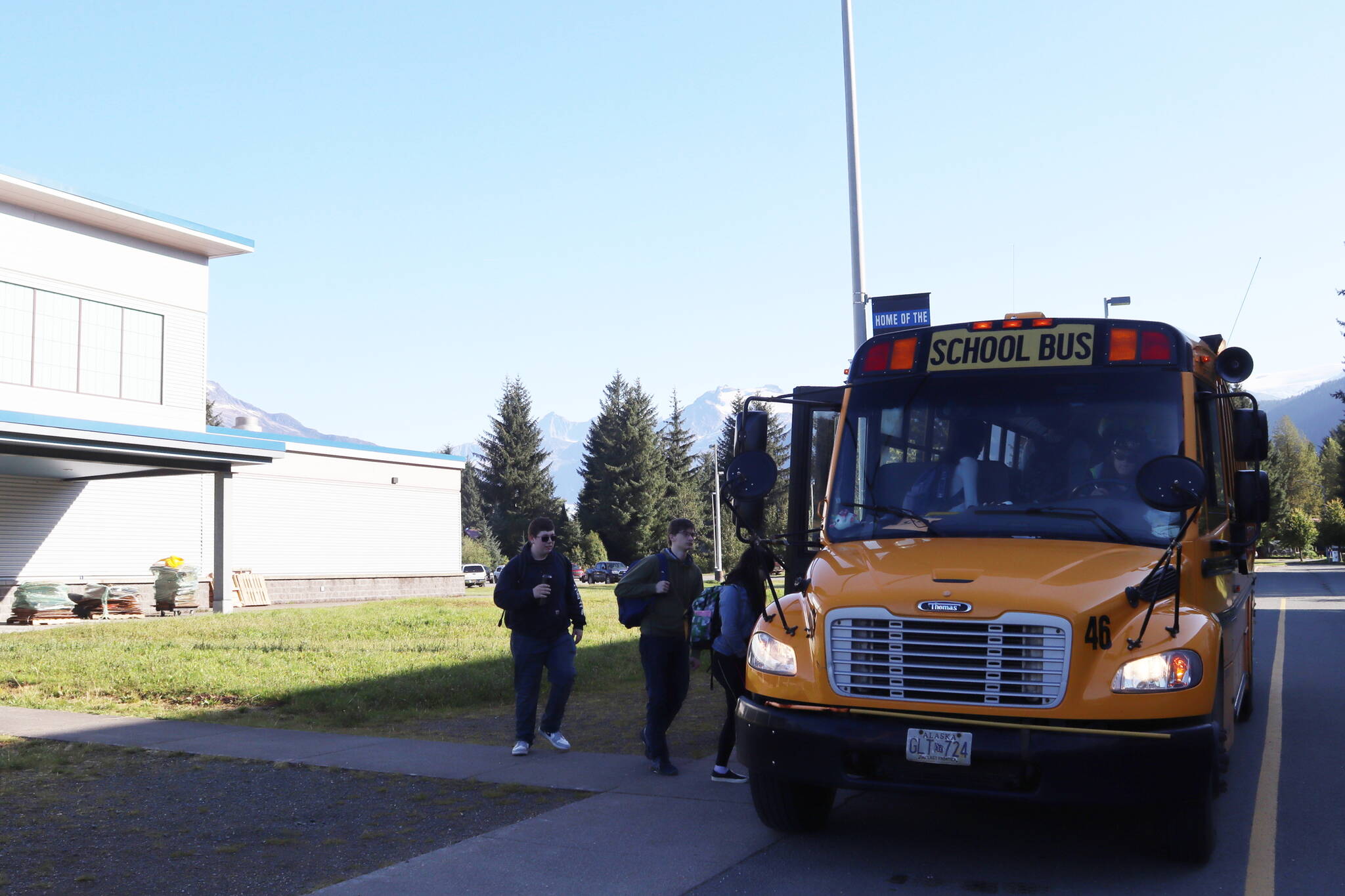 Students heading to Juneau-Douglas High School: Yadaa.at Kalé board a bus at Thunder Mountain Middle School on Wednesday morning. While the stop is designated as a park-and-ride option for students, those boarding the bus either walked to the stop or were dropped off by parents. (Mark Sabbatini / Juneau Empire)