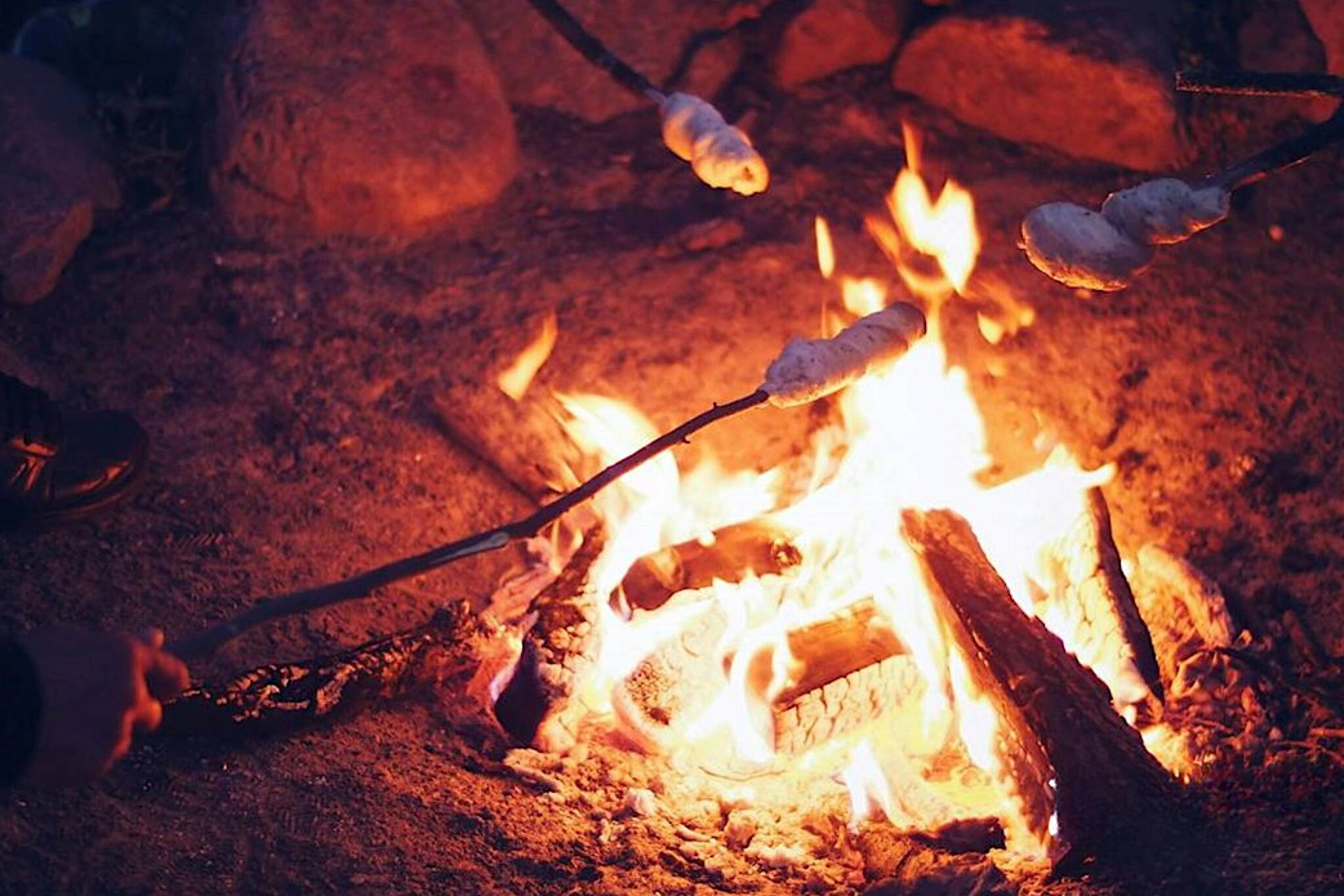 Roasting marshmallows over a campfire. (U.S. Forest Service photo)