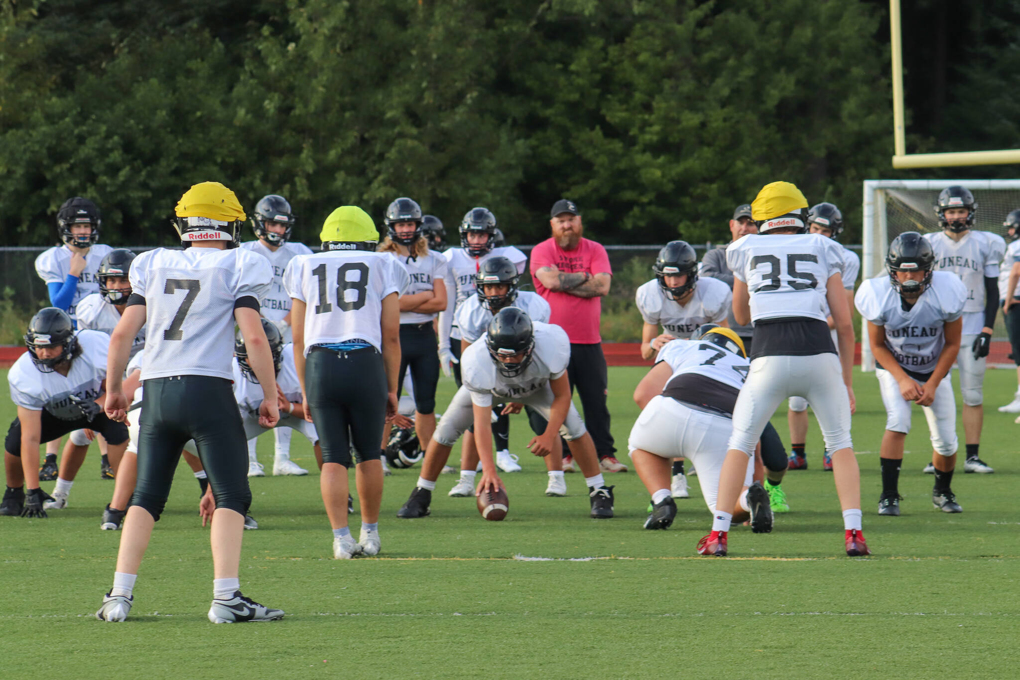 Juneau Huskies players face off against each other during practice Tuesday in preparation for Saturday’s game against Service High School at Adair-Kennedy Memorial Park. (Jasz Garrett / Juneau Empire)