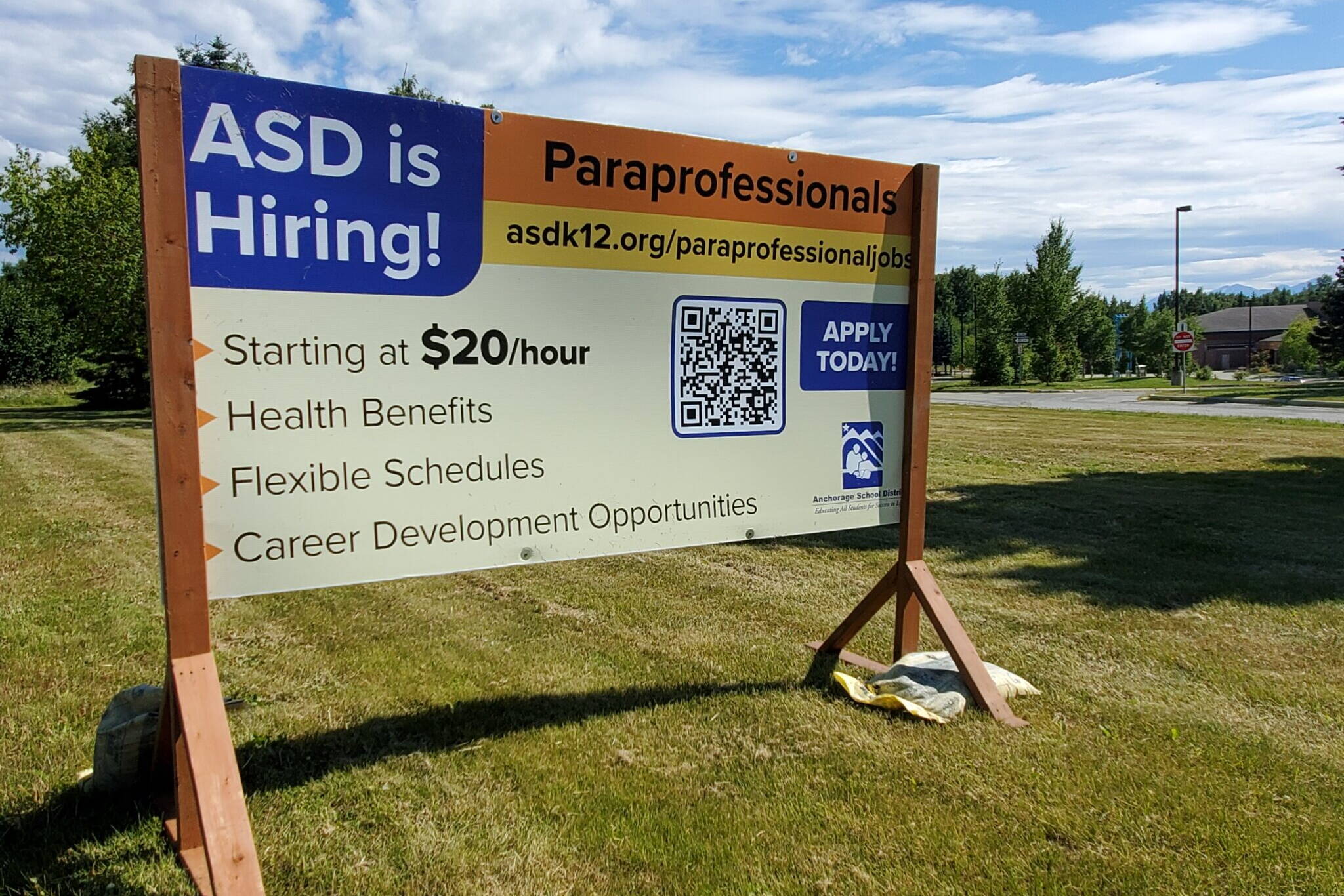 A sign outside posted on July 20, 2024, outside of Kincaid Elementary School advertises job openings in the Anchorage School District. (Yereth Rosen/Alaska Beacon)