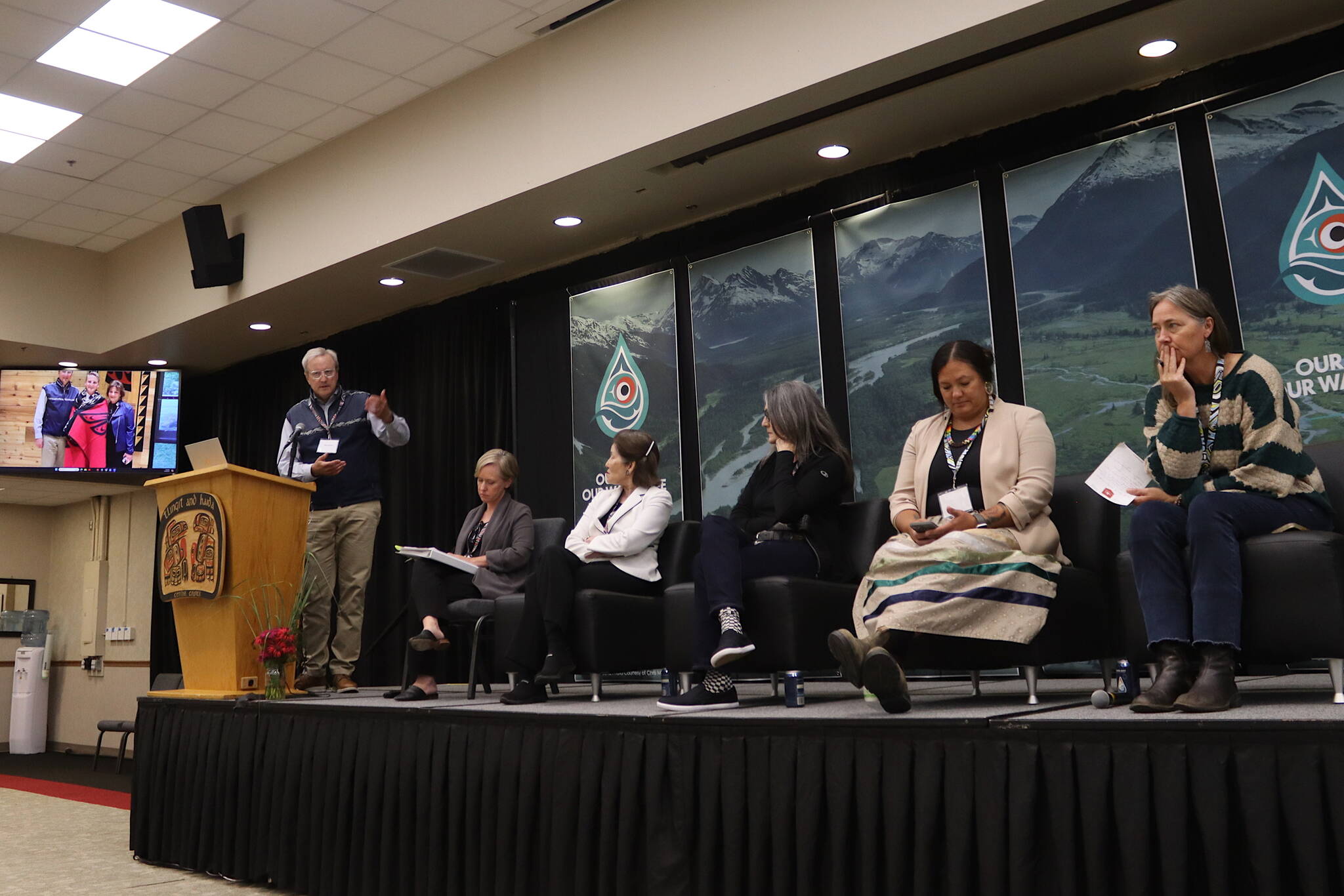 Robert Sisson (left), former commissioner of the International Joint Commission, presides over a panel discussion Wednesday during the third annual Transboundary Mining Conference at Elizabeth Peratrovich Hall. (Mark Sabbatini / Juneau Empire)