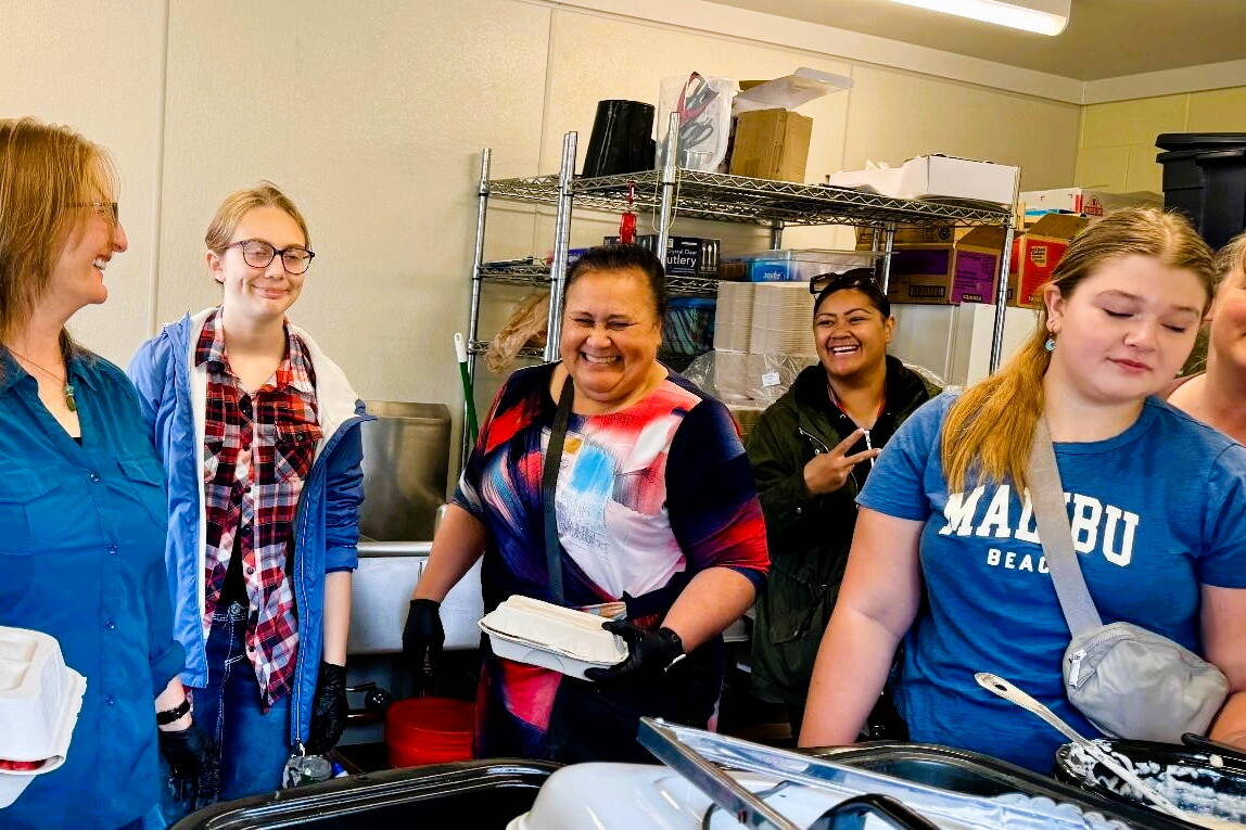 Kueni Ma’ake, Ofeina Kivalu, Jaime and Alanna Zellhuber, Aubrey Neuffer and Mary Fitzgerald of the Church of Jesus Christ of Latter-day Saints in Juneau serve meals to those affected by this month’s flooding of the Mendenhall River. (Photo provided by the Church of Jesus Christ of Latter-day Saints in Juneau)