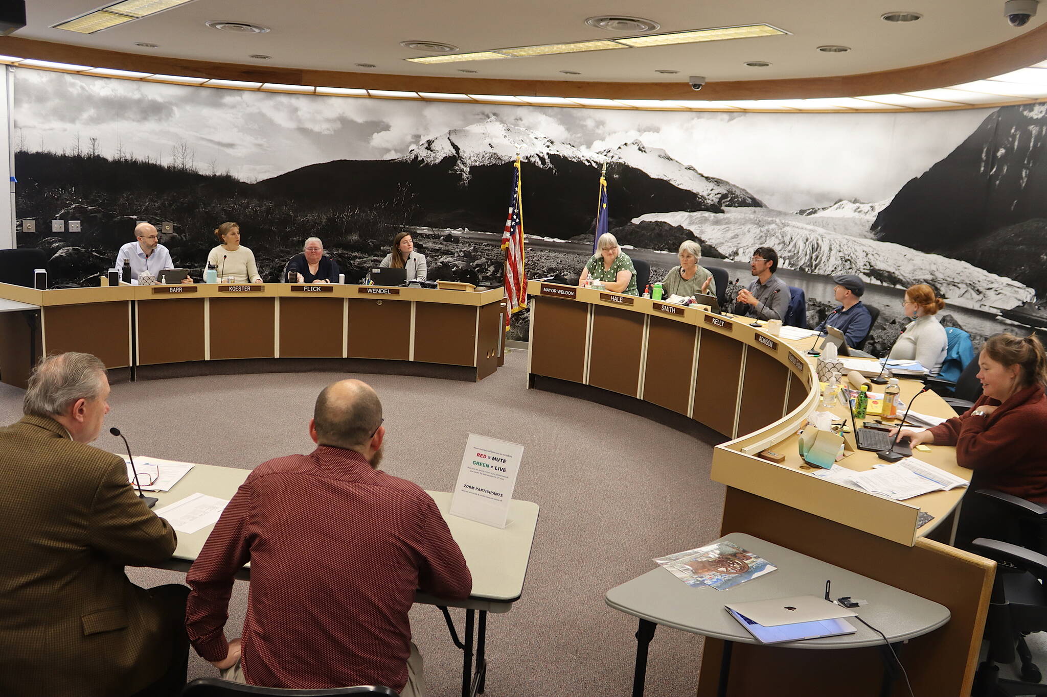 Bartlett Regional Hospital leaders (foreground) present details of their request for financial support to keep hospice, home care and residential substance abuse recovery programs operating during a Juneau Assembly Finance Committee meeting Wednesday night. (Mark Sabbatini / Juneau Empire)