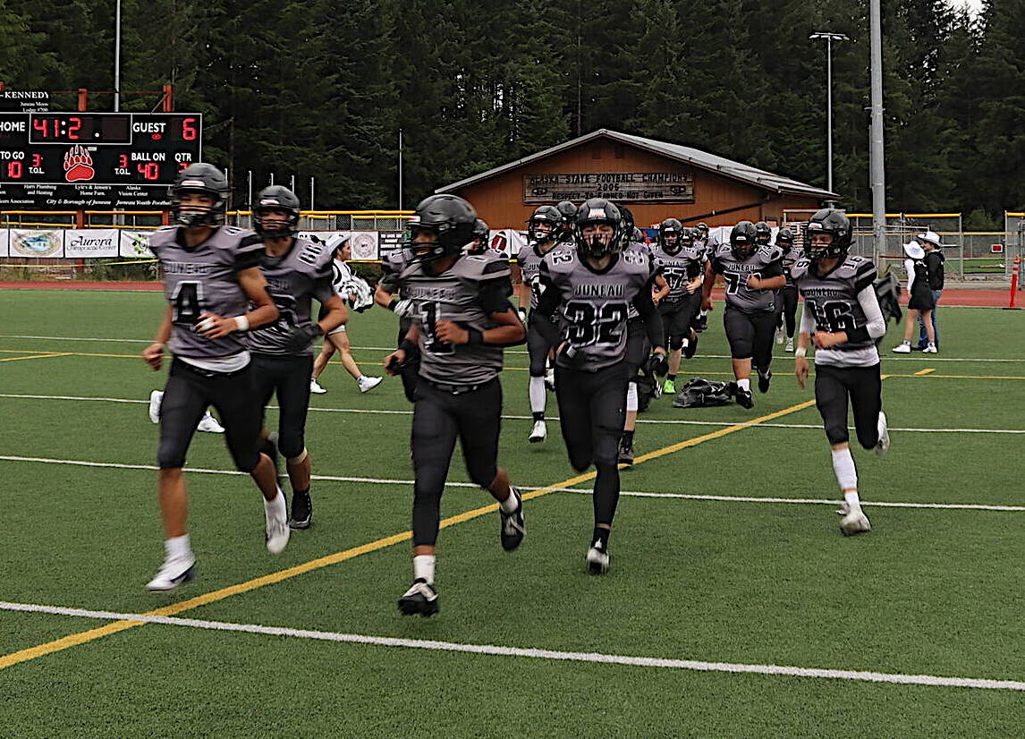 The Juneau Huskies, seen here taking the field for the second half of an Aug. 24 home game against Service High School, prevailed in a road trip game Friday night in Bishop, California, defeating Bishop Union High School 17-6. (Mark Sabbatini / Juneau Empire file photo)