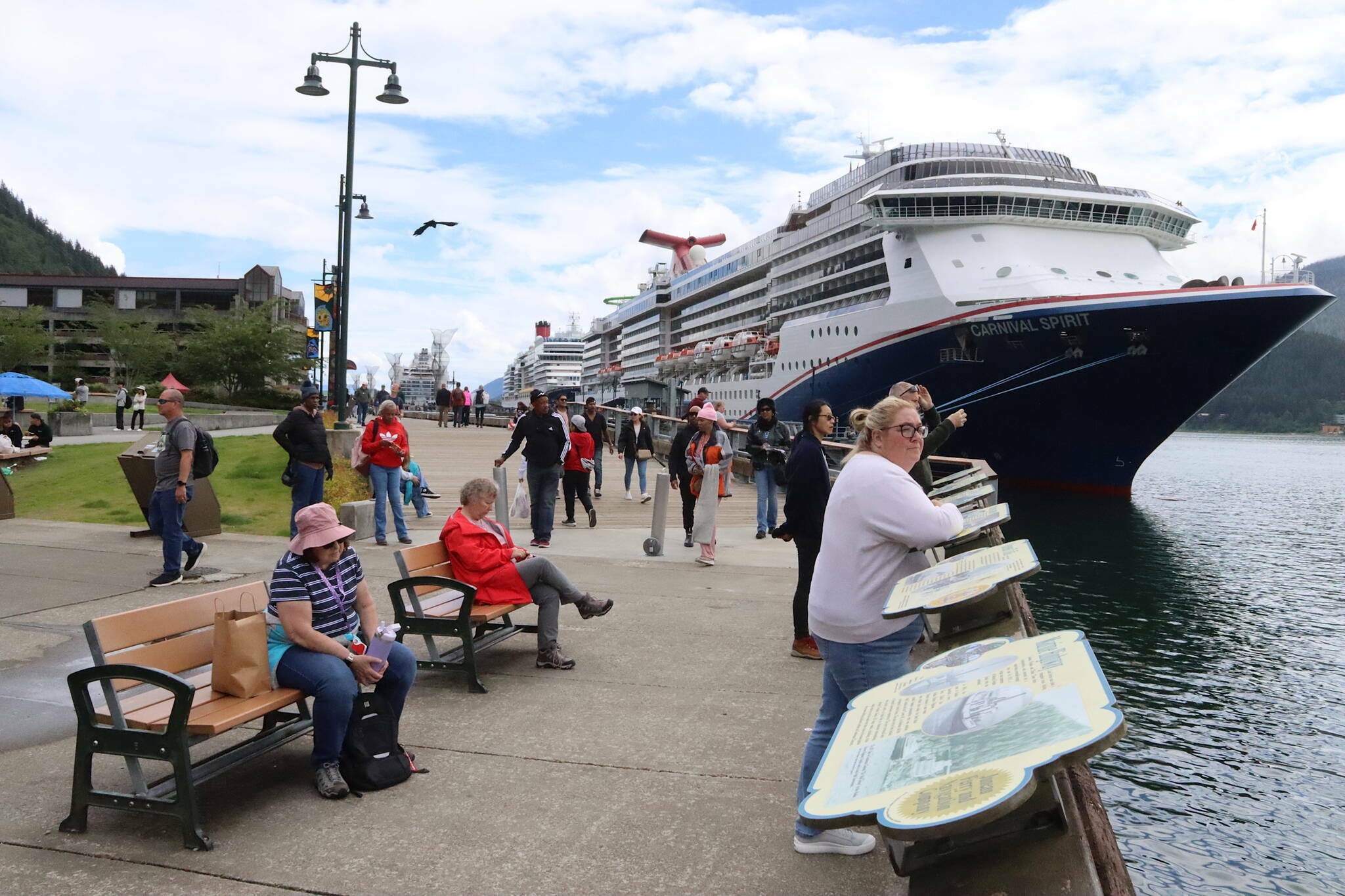 Cruise ships and passengers visit Marine Park on Saturday, June 22, 2024. A proposition on the fall ballot would ban large cruise ships on Saturday and the Fourth of July in Juneau. (Mark Sabbatini / Juneau Empire file photo)