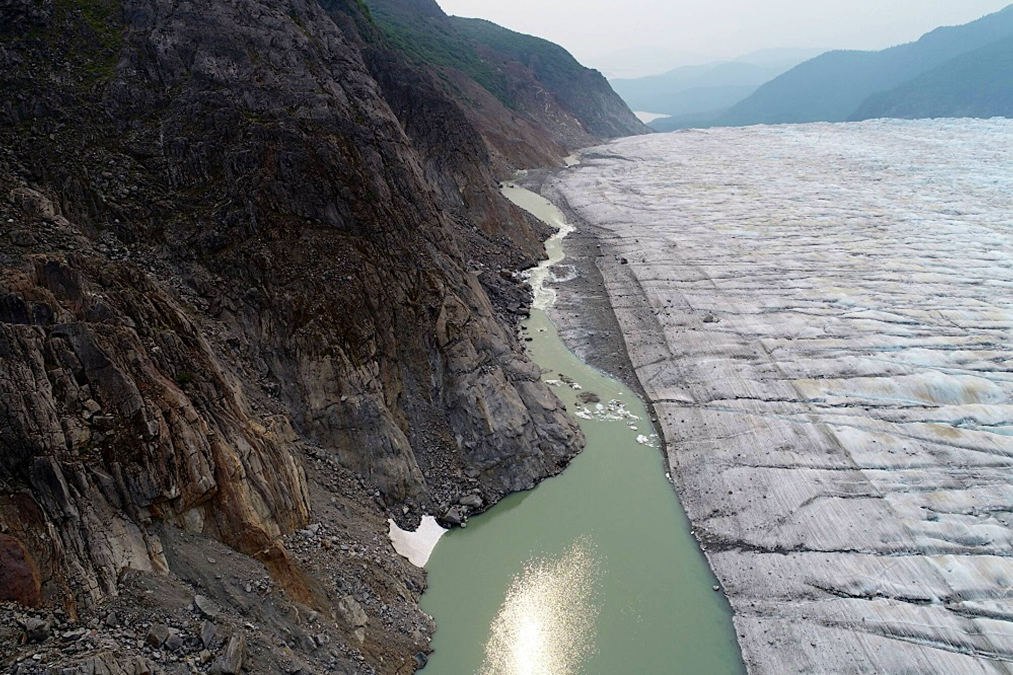 An overhead view of the overflowing portion of the glacier-dammed lake at Suicide Basin. (Christian Kienholz / Alaska Coastal Rainforest Center)