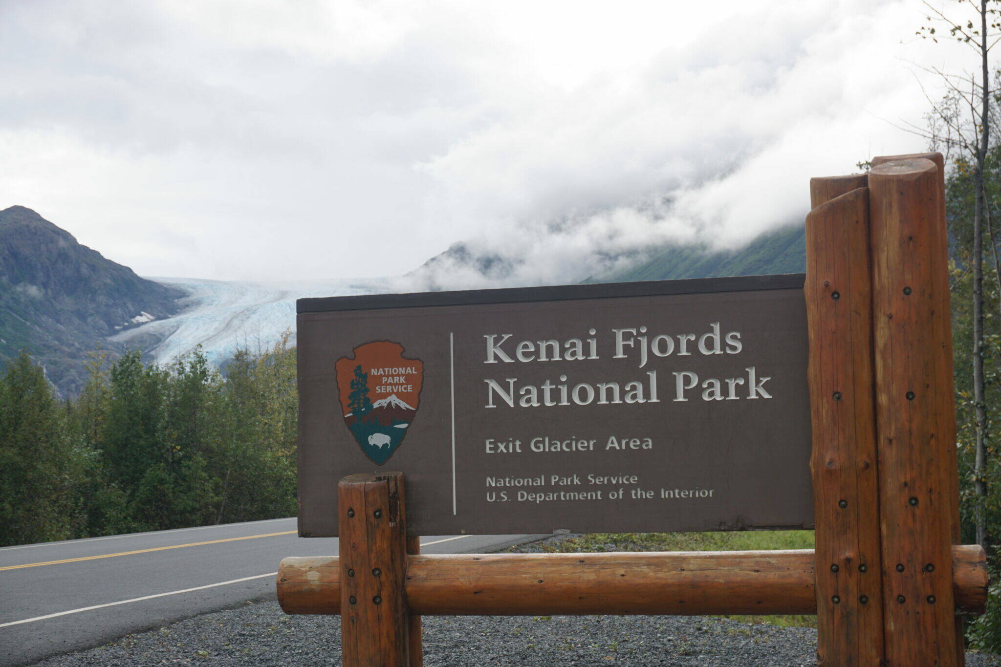 The road entrance to Kenai Fjords National Park is marked by a sign, seen on Aug. 27, 2022. The National Park Service has released its annual report on the economic impact of park visitation. Alaska is among the states that reaps the most economic benefit from visitors to its national parks, according to the report. (Yereth Rosen/Alaska Beacon)