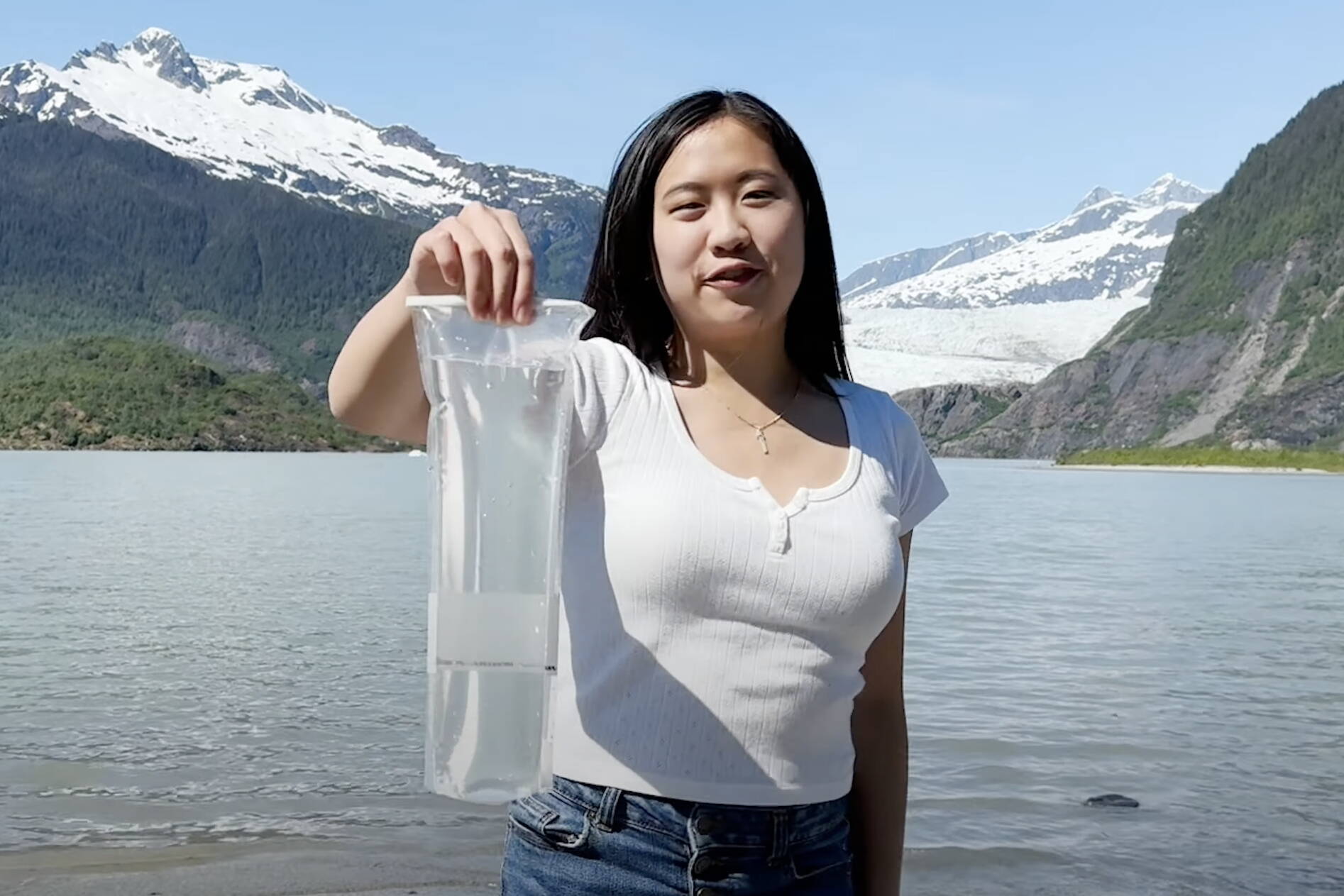 Elizabeth Djajalie, a Juneau resident attending Harvard University, explains the science of DNA metabarcoding, in a video at the Mendenhall Glacier for the Khan Academy Breakthrough Junior Challenge. (Screenshot from video by Elizabeth Djajalie)