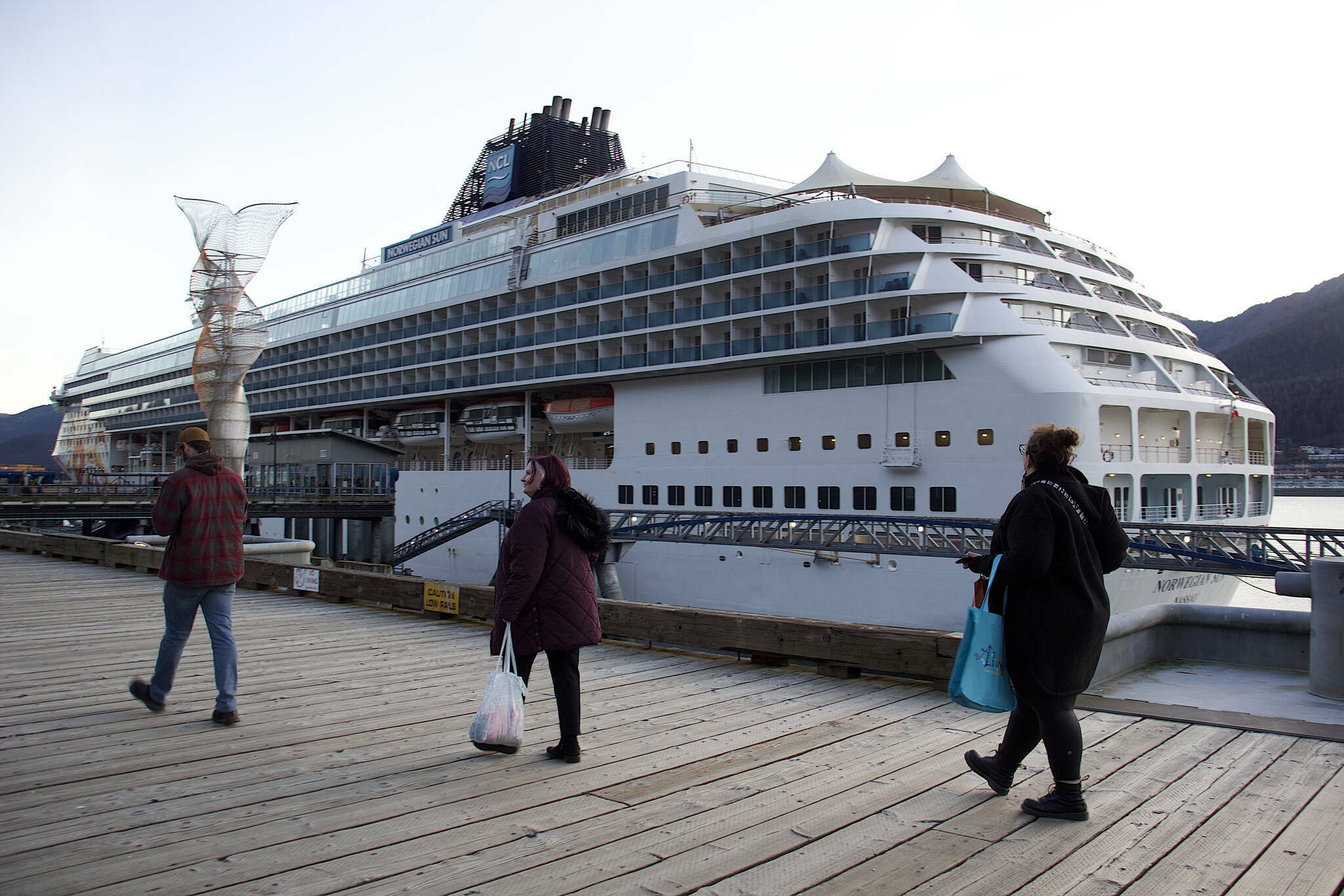 Passengers return to the Norwegian Sun on Oct. 25, 2023. (Mark Sabbatini / Juneau Empire file photo)