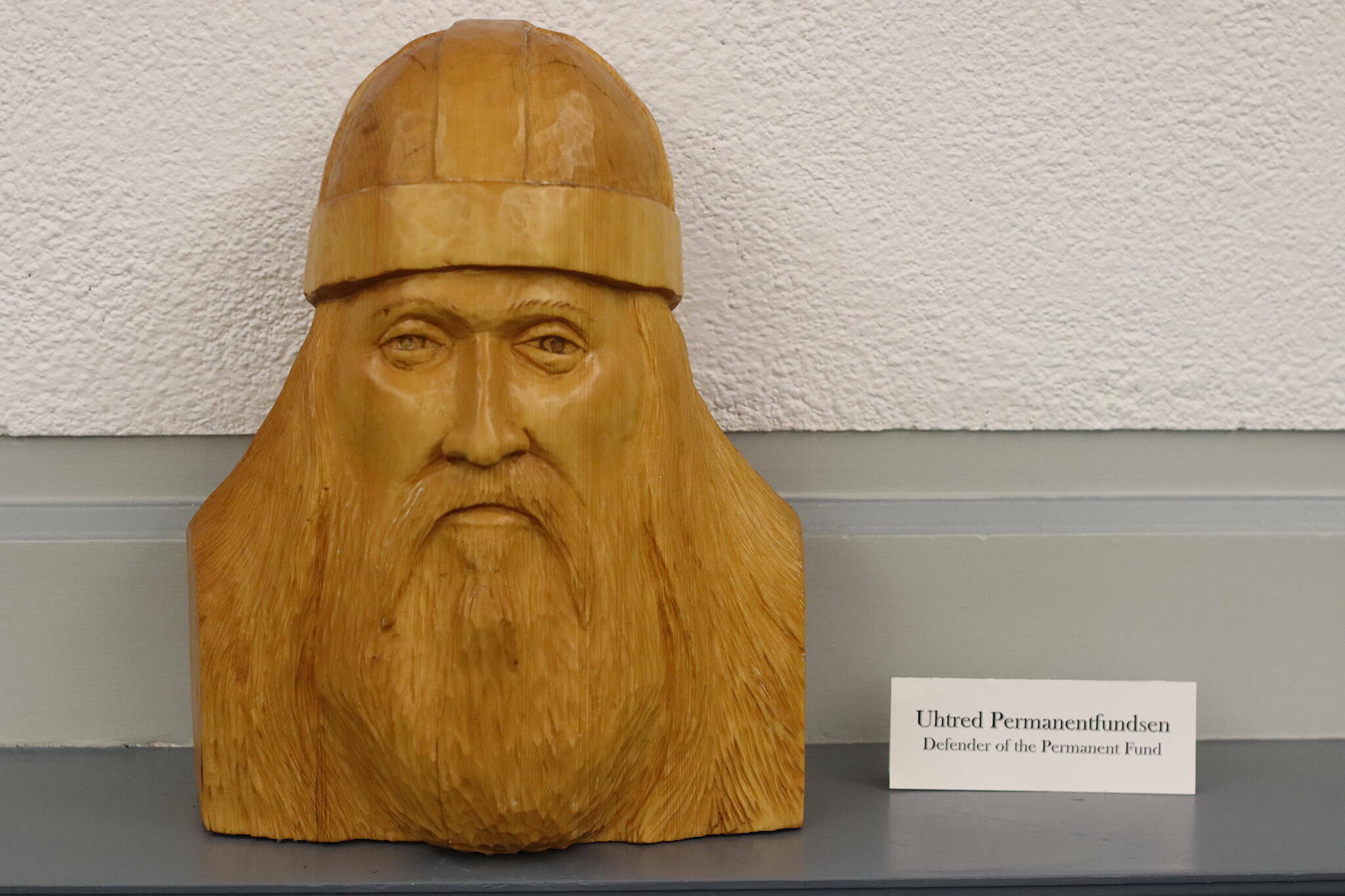 Uhtred Permanentfundsen, the “defender of the Permanent Fund,” occupies a shelf near the head of the table in the Senate Finance Committee room at the Alaska State Capitol. (Mark Sabbatini / Juneau Empire file photo)