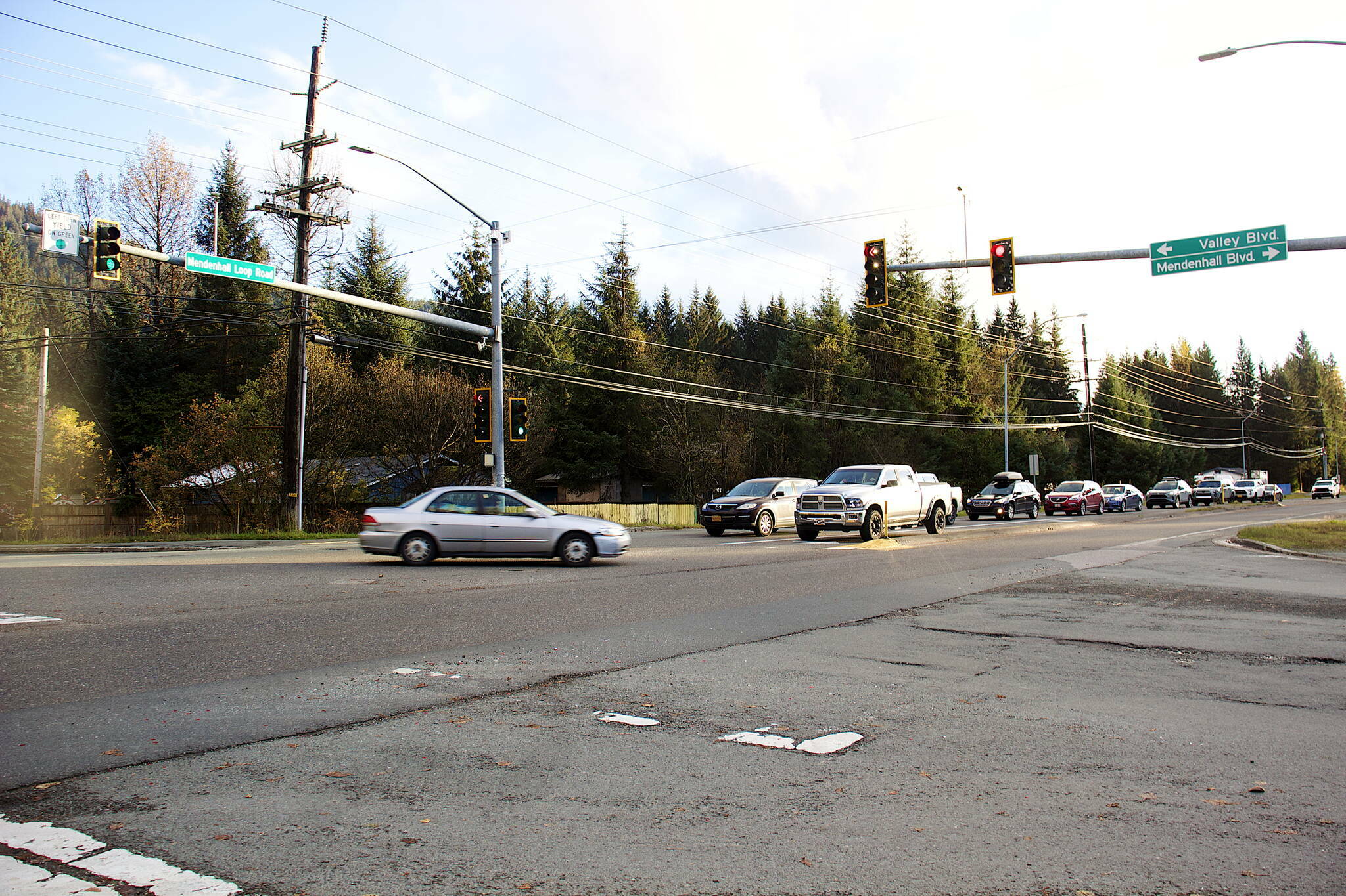 Rush-hour traffic backs up at a traffic light on Mendenhall Loop Road at the intersection of Valley Boulevard and Mendenhall Boulevard on Oct. 11, 2023. The Juneau Planning Commission approved a roundabout for the intersection on Tuesday night. (Mark Sabbatini / Juneau Empire file photo)