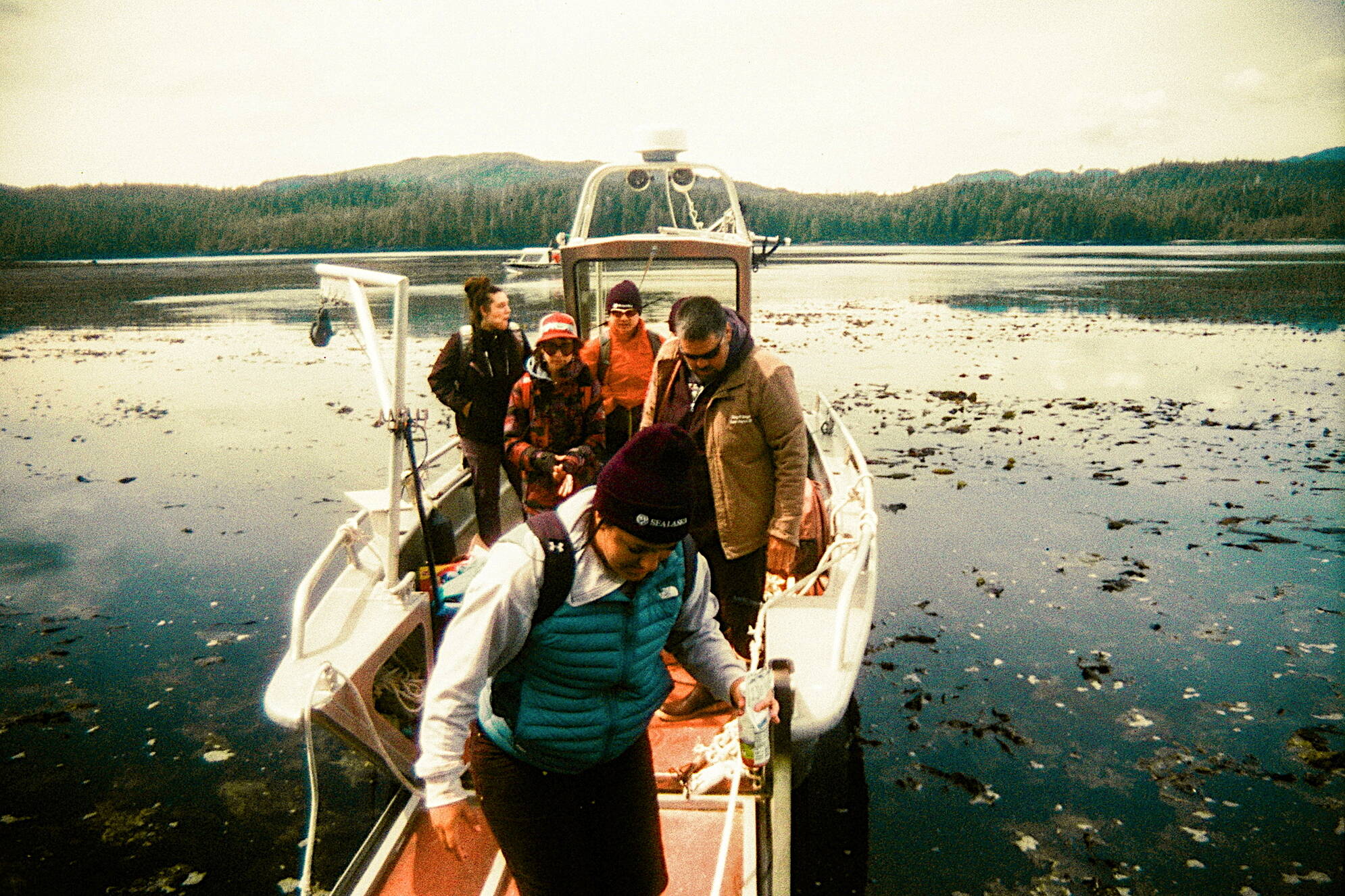 “Back to Lands Week” participants prepare to offload in Howkan. Over 100 ago, the villages of Howkan, Sukkwan and Klinkwan dissolved in order to form a school in the new village of Hydaburg. (Photo by Addy Mallott)