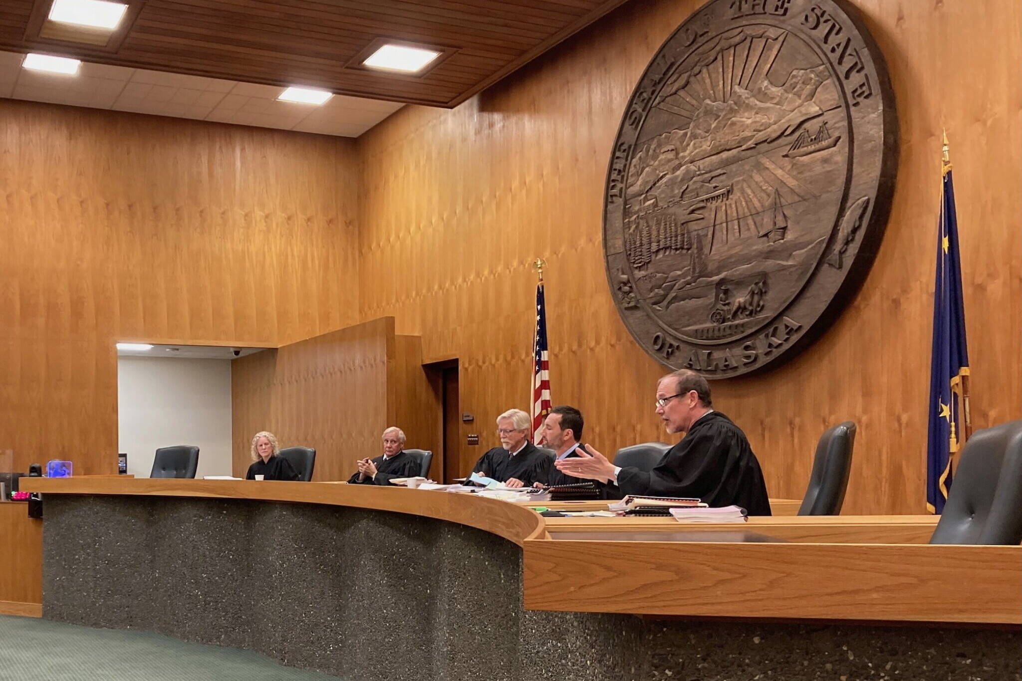 Alaska Supreme Court Justice Jude Pate, right, asks a question during oral arguments in a case concerning correspondence education allotments, on June 27, 2024, in the Boney Courthouse in Anchorage. (Andrew Kitchenman/Alaska Beacon)