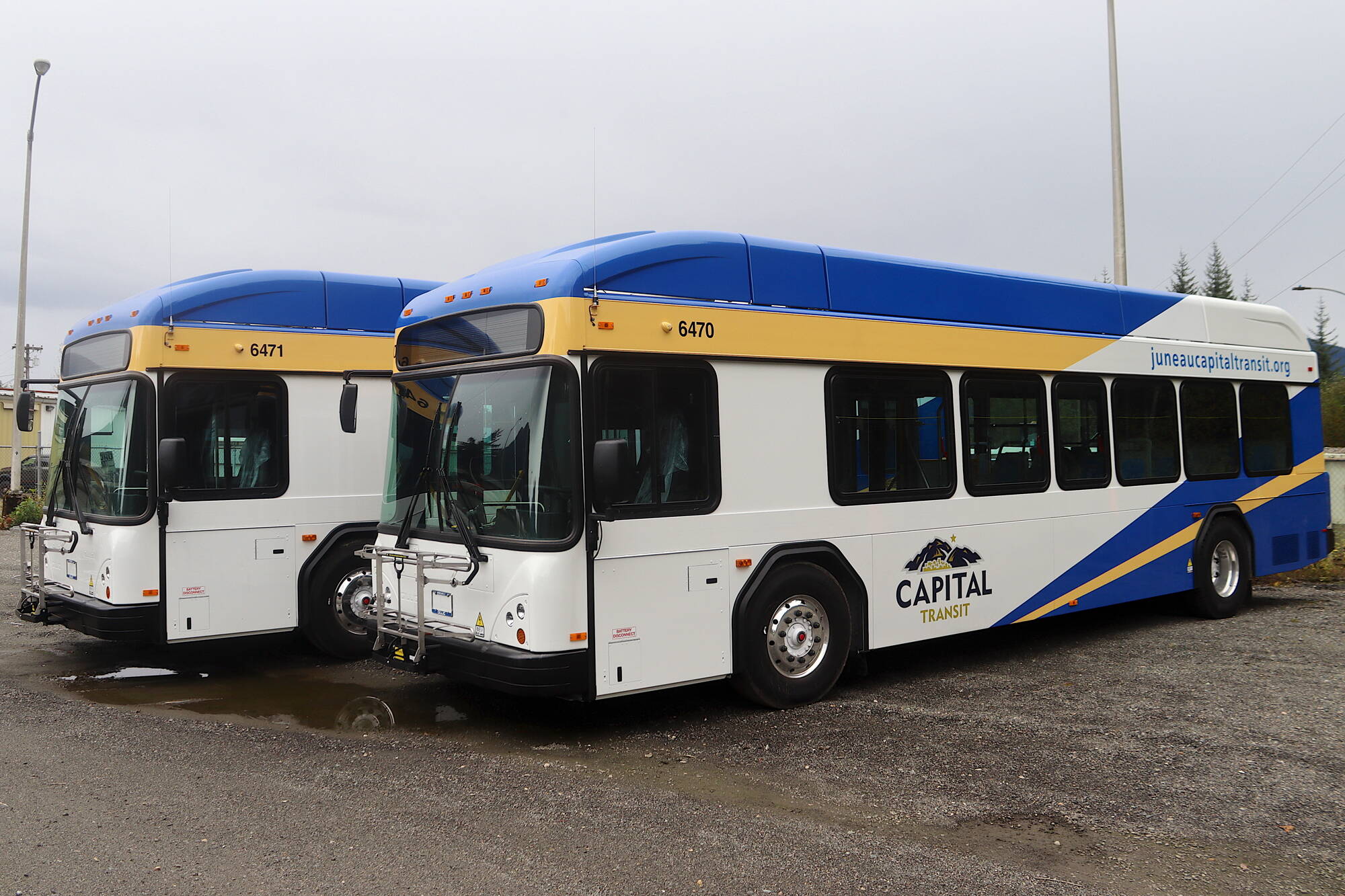 Two of the seven Gillig electric buses ordered by the City and Borough of Juneau await inspection at the Capital Transit fleet facility on Monday. The other buses are expected to arrive by mid October and the first use of the vehicles for paying passengers is scheduled around the beginning of the new year. (Mark Sabbatini / Juneau Empire)