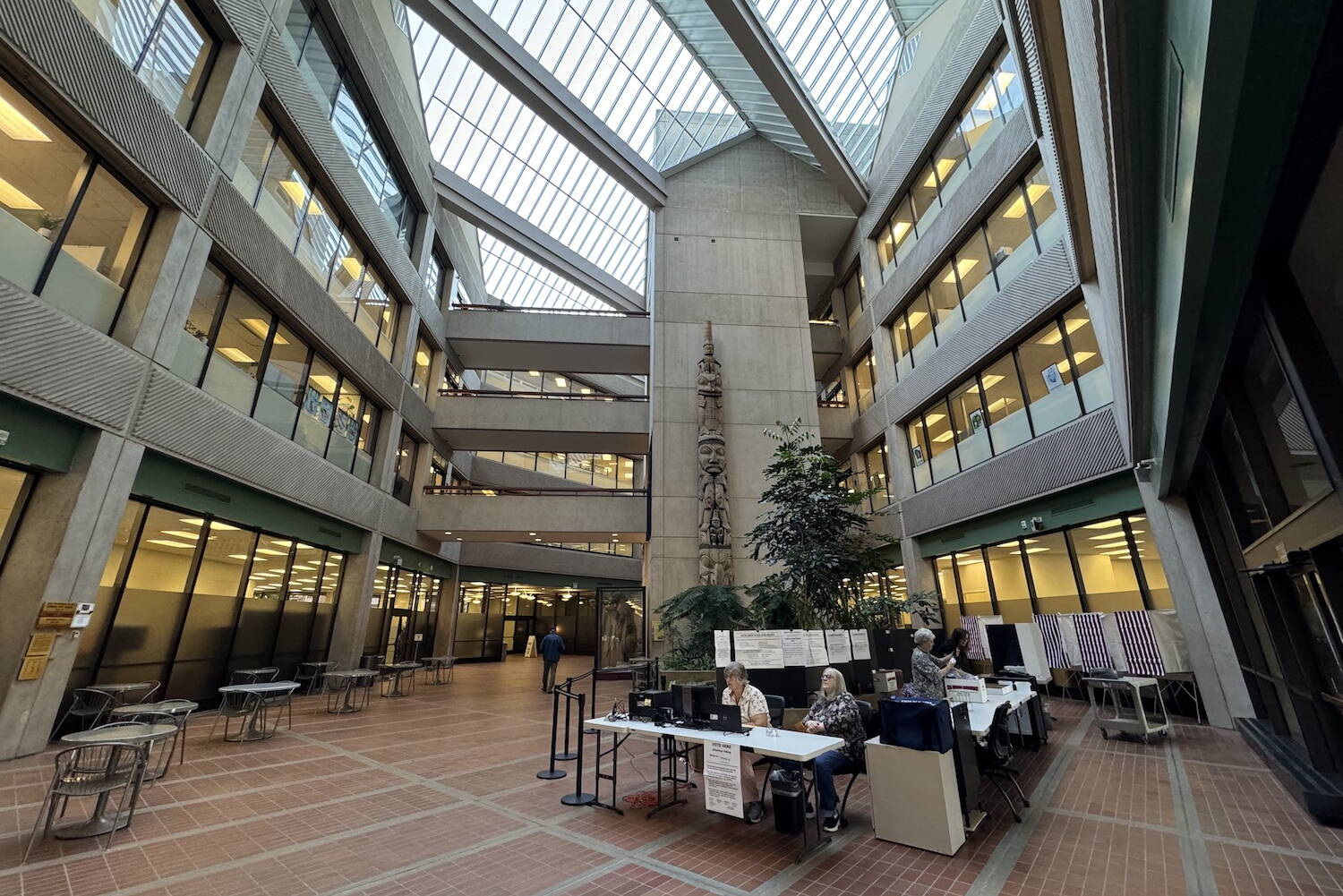 An early voting station is set up in the atrium of the State Office Building in Juneau on Monday, Aug. 5, 2024, the first day of early voting for the 2024 Alaska primary election. (James Brooks/Alaska Beacon)