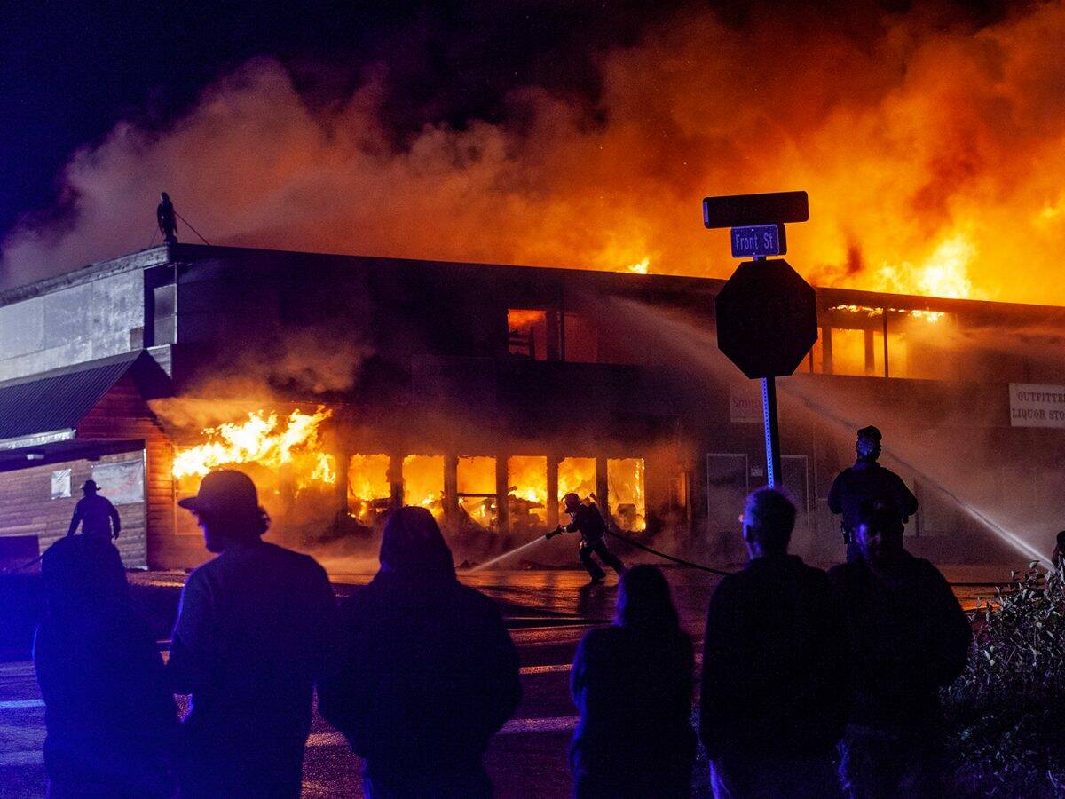 Four businesses and four apartments in a building owned by Mike Ward burn on Saturday, Oct. 5, 2024, in Haines. It’s not yet clear exactly how the fire started, but Ward and others on the scene said it appeared to have been set in one of the apartments. (Rashah McChesney/Chilkat Valley News)