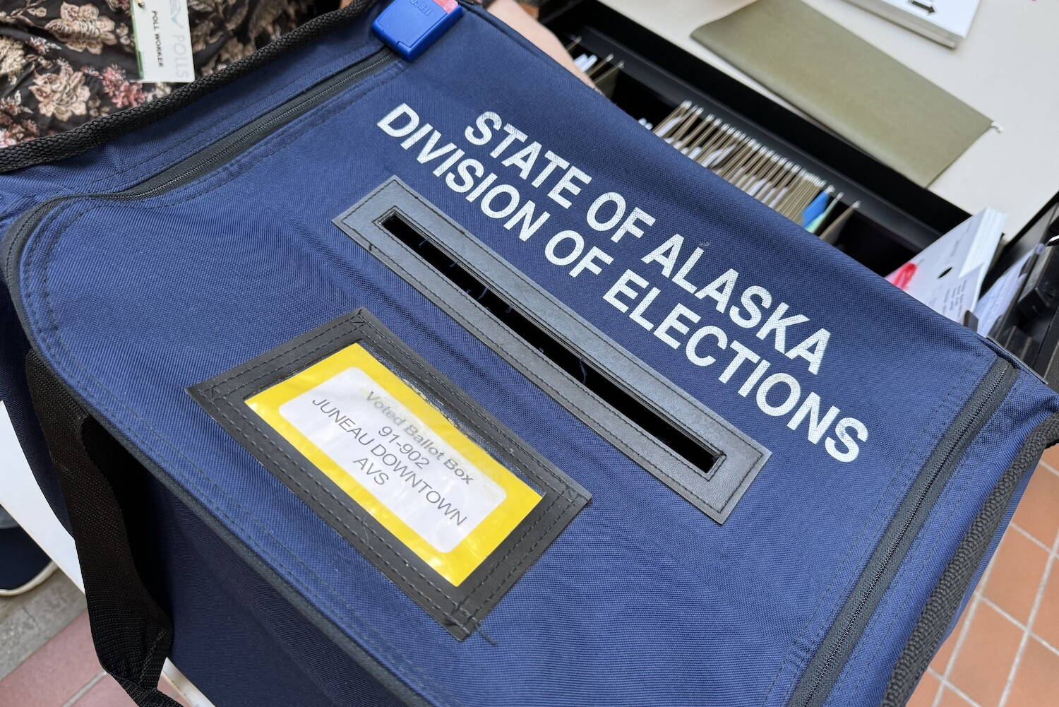 An early voting station is set up in the atrium of the State Office Building on Monday, Aug. 5, 2024, the first day of early voting for the 2024 Alaska primary election. (James Brooks/Alaska Beacon)