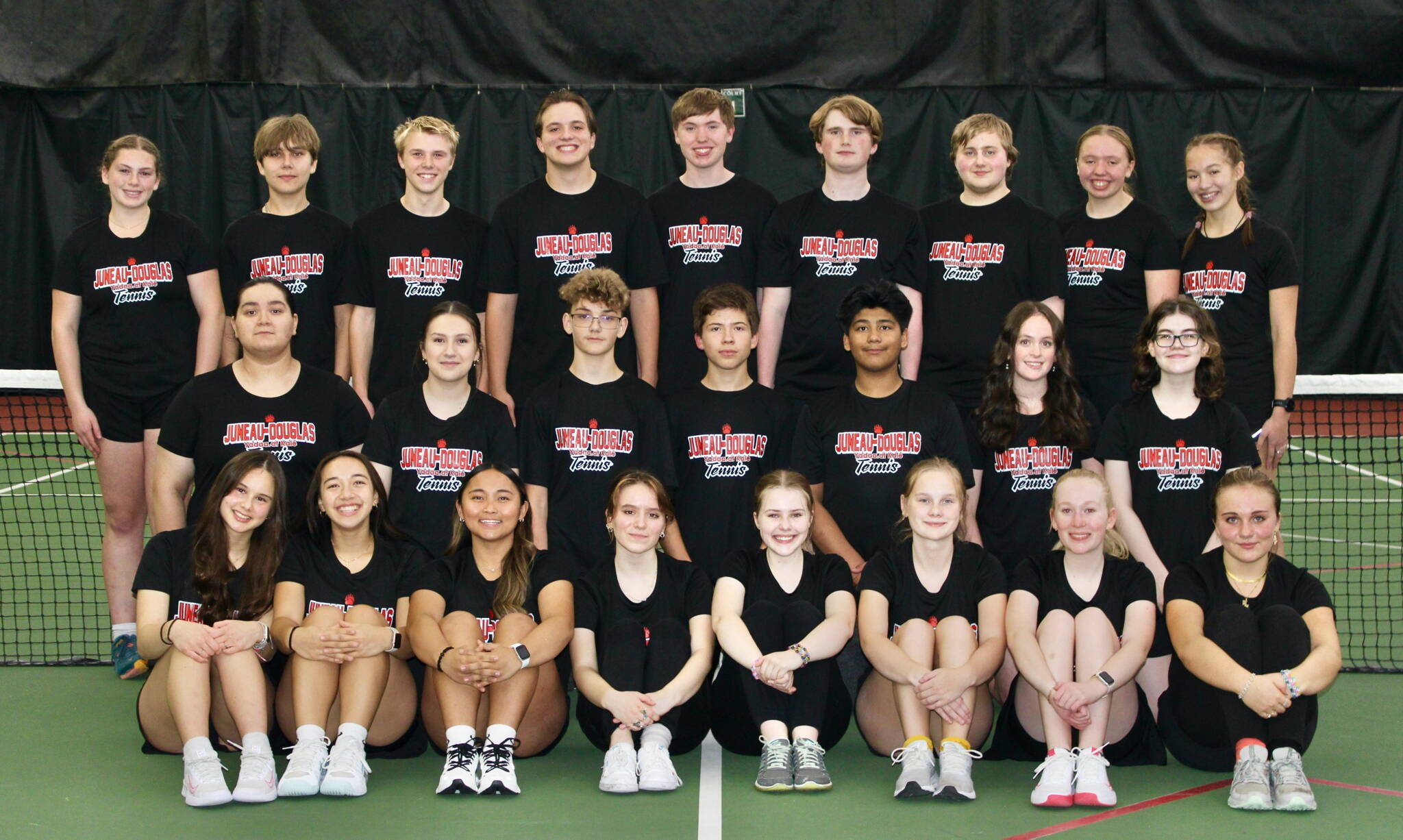 The Juneau-Douglas High School: Yadaa.at Kalé tennis team. Seated left to right: Aurora Madsen, Isabella Reyes-Boyer, Milina Mazon, Maya Breedlove, Madeline Gibson, Lydia Heidemann, Hazel McWilliams and Maggie Fairchild. Middle L-R: Daniela Lamas, Shakti Tellez-Perez, Skylar Hayes, Dan Degener, Jaime Snedden, Riley Dale and Katharine Hieb. Standing L-R: Paige Kirsch, Isaac Hill, Elliot Welch, Kajson Cunningham, Hayden Soboleff, Alex Rehfeldt, Taliesin Paul, Riley Soboleff and Ainsley Mallott. (Photo courtesy JDHS Tennis)