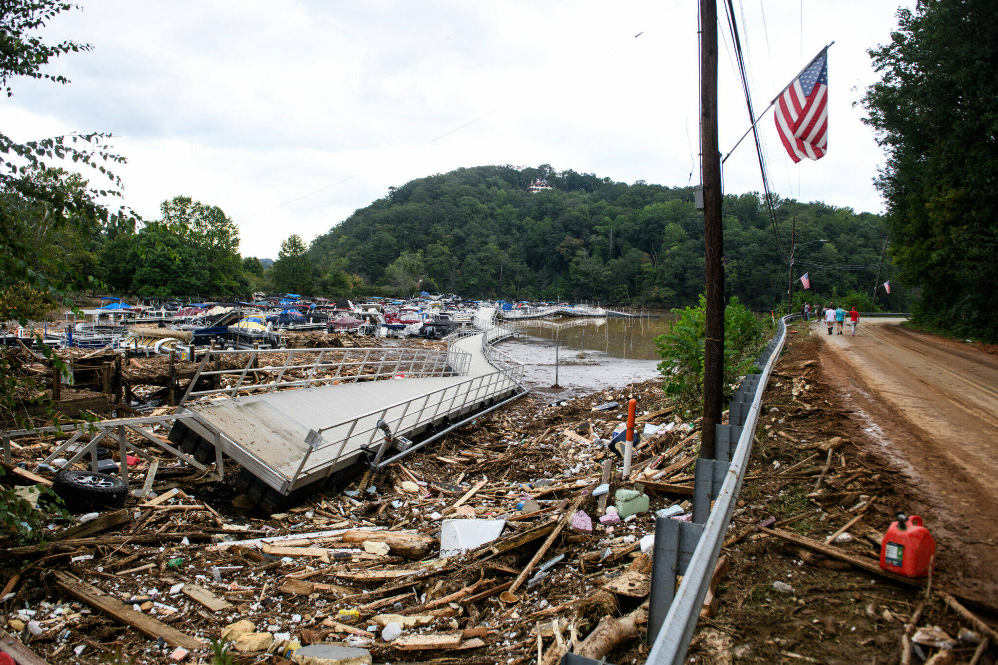 The Rocky Broad River flows into Lake Lure and overflows the town with debris from Chimney Rock, North Carolina after heavy rains from Hurricane Helene on Sept. 28, 2024, in Lake Lure, North Carolina. Approximately six feet of debris piled on the bridge from Lake Lure to Chimney Rock, blocking access. (Melissa Sue Gerrits/Getty Images)