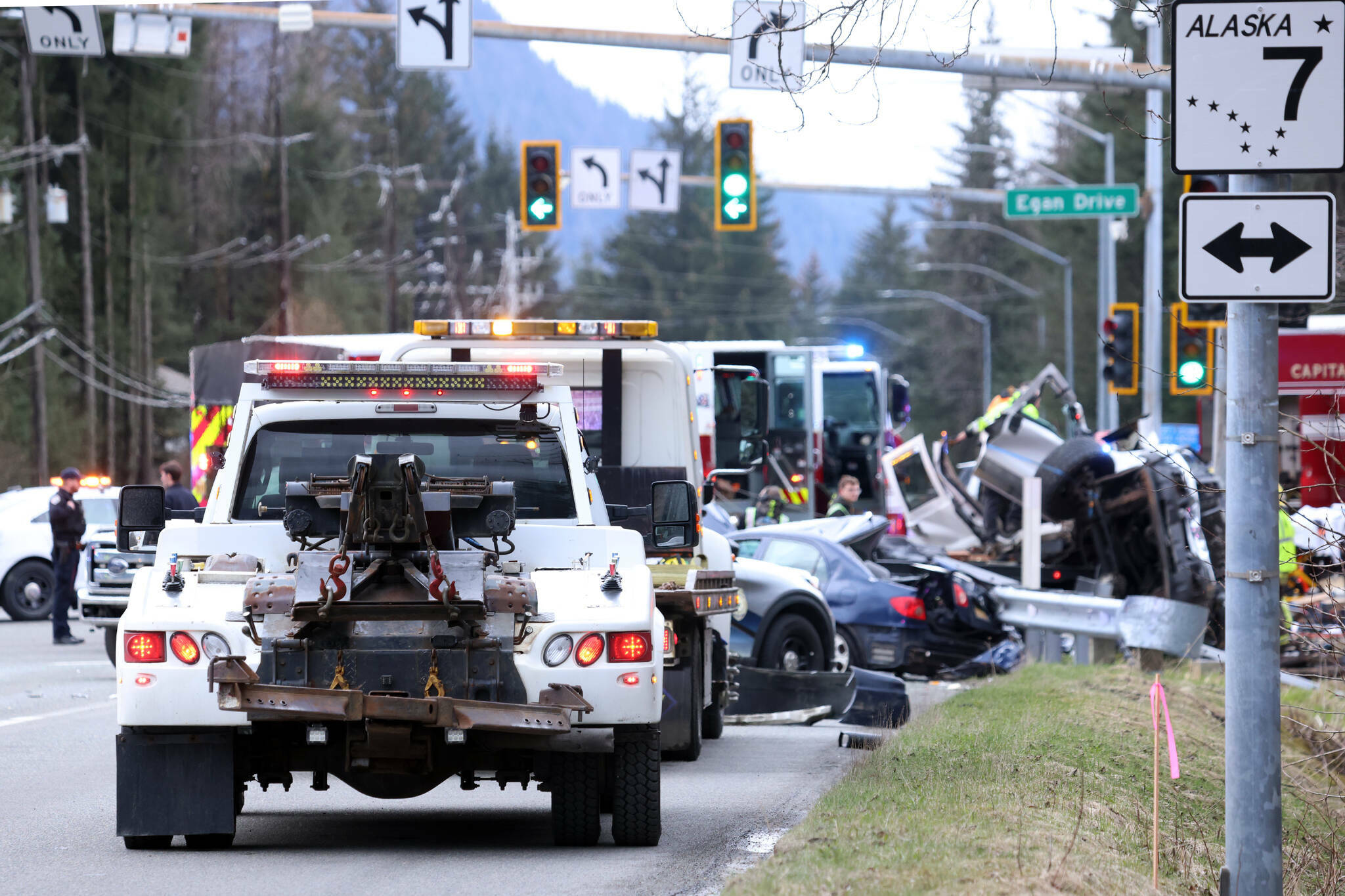 A line of vehicles responds to the scene of a fatal wreck at Egan Drive and Mendenhall Loop Road on April 26, 2023. The two-vehicle crash involved a car and a truck, with a female passenger inside the truck pronounced dead at the scene. (Ben Hohenstatt / Juneau Empire file photo)