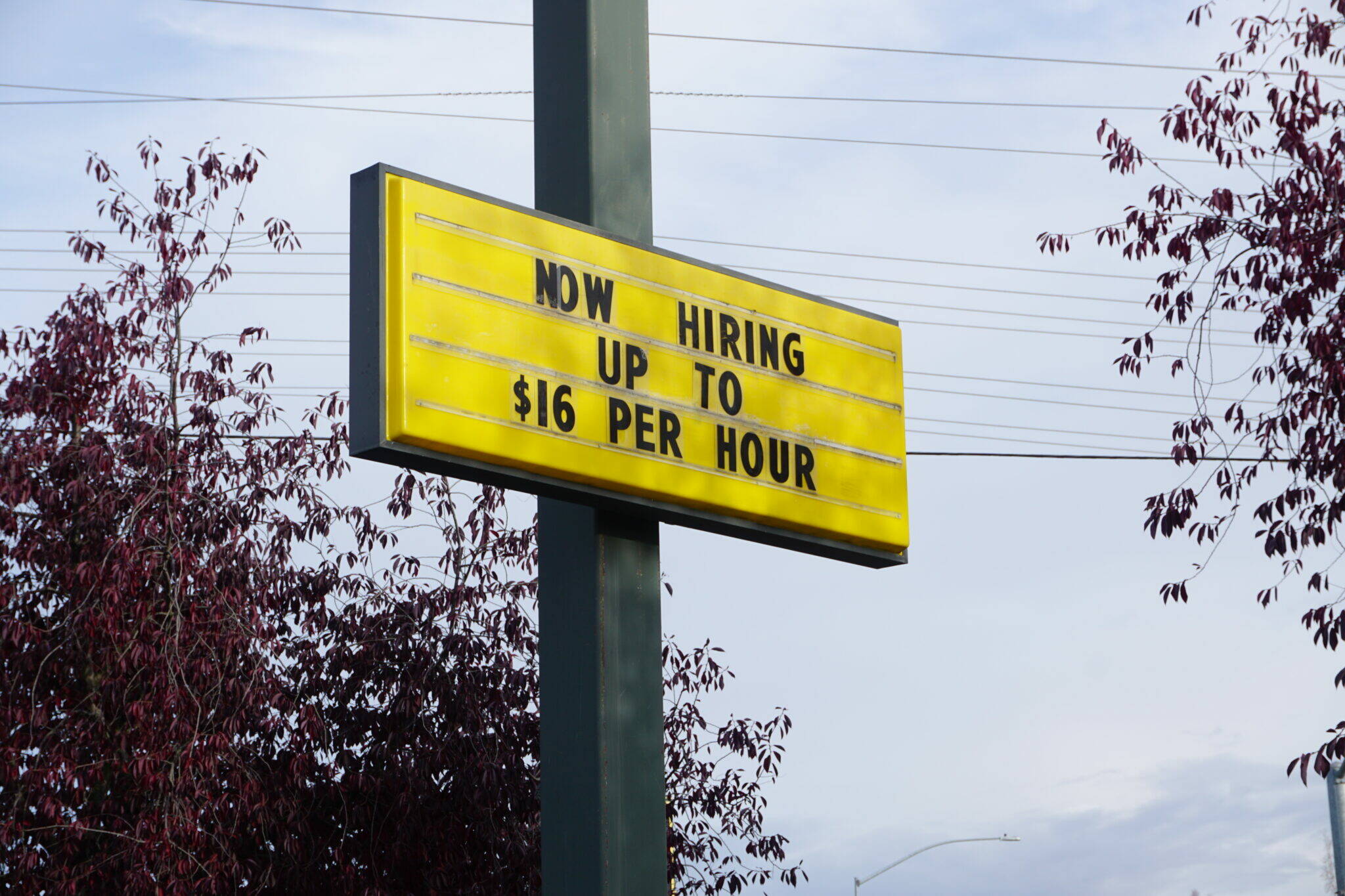 A sign outside of a McDonald’s restaurant in Midtown Anchorage, seen on Oct. 7, advertises openings for jobs that pay up to $16 an hour. Voters will decide the fate of a ballot measure that would set a $15-an-hour minimum wage by 2027 and mandate paid sick leave for workers. (Yereth Rosen/Alaska Beacon)