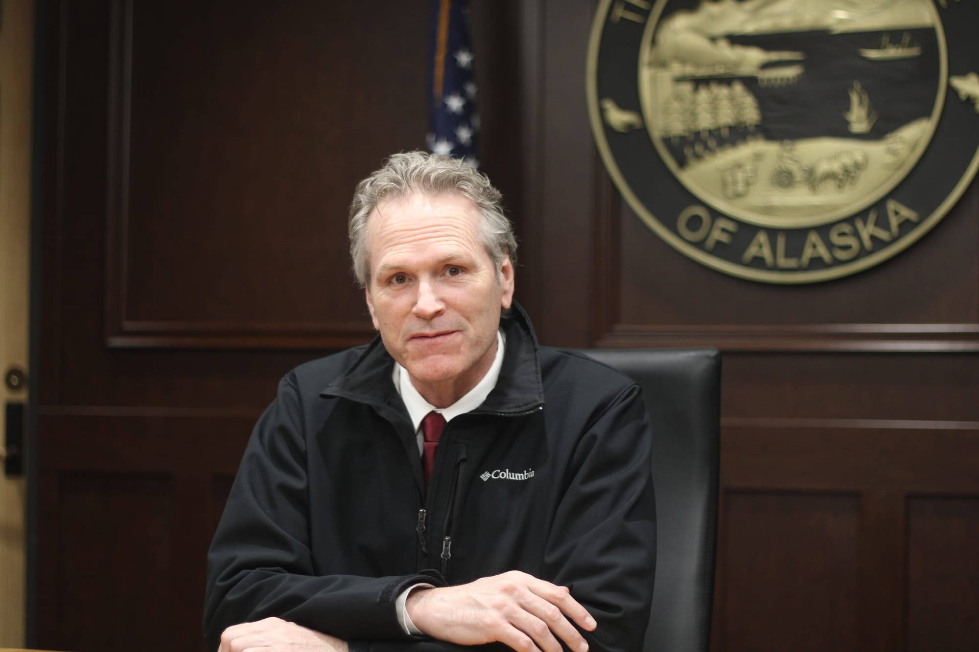 Gov. Mike Dunleavy sits in the Cabinet Room at his Anchorage office Tuesday. (Nathaniel Herz/Northern Journal)