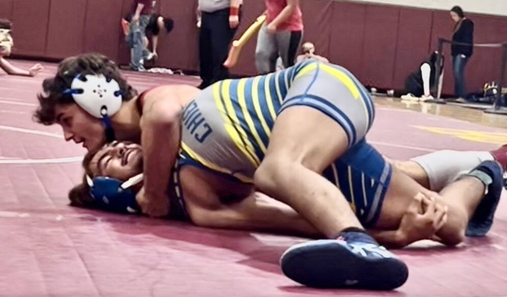 Juneau-Douglas High School: Yadaa.at Kalé senior Justus Darbonne pins a Metlakatla opponent during the Hoonah Invitational wrestling tournament on Saturday. (Photo courtesy JDHS wrestling)