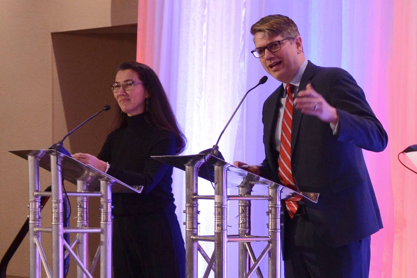 Republican U.S. House candidate Nick Begich speaks to an audience at the Alaska Chamber of Commerce’s U.S. House debate on Thursday, Oct. 10, 2024, in Fairbanks. At left is incumbent Rep. Mary Peltola, D-Alaska. The two candidates again participated in a forum on Monday. (James Brooks/Alaska Beacon)