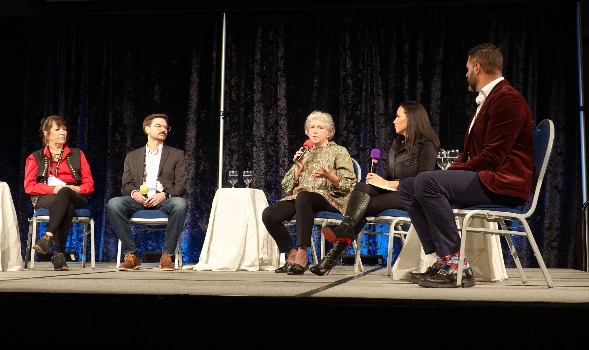 A panel discussion about cultural tourism in Alaska takes place Tuesday between (left to right) Camille Ferguson, economic development director of the Sitka Tribe of Alaska; Zach Dunlap, operations manager for Doyon; Susan Bell, vice president of strategic initiatives for Huna Totem Corp.; Emily Edenshaw, president and CEO of the Alaska Native Heritage Center; and McHugh Pierre, president and CEO of Goldbelt Inc. during the opening day of the Alaska Travel Industry Association convention at Centennial Hall. (Laurie Craig / Juneau Empire)